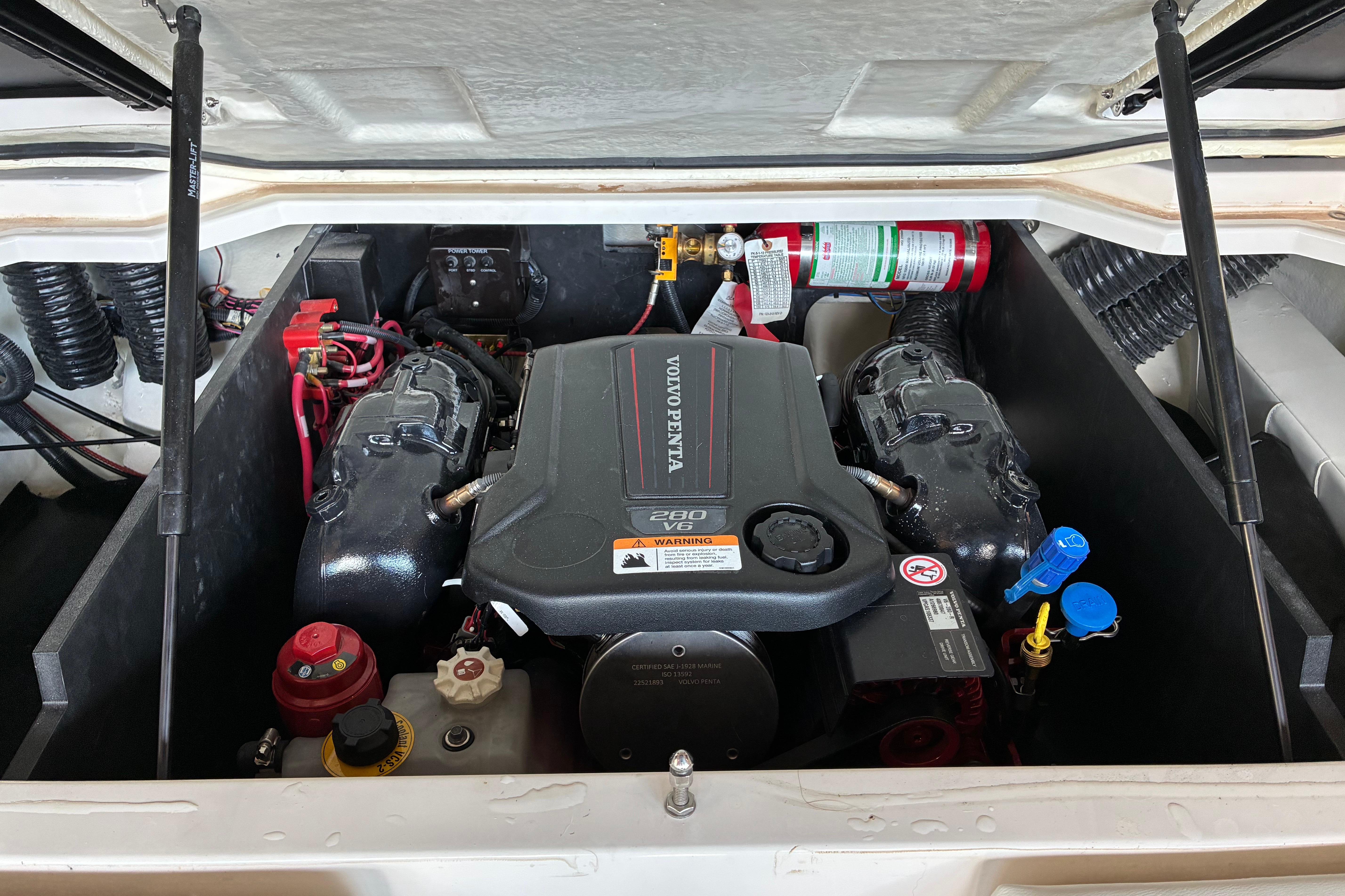 Engine compartment of 2025 Regal LS2 boat, featuring Volvo Penta V6 engine.