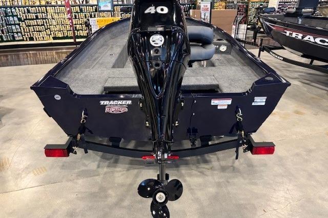 2026 Tracker Super Guide V-16 T boat with 40 HP motor in showroom.