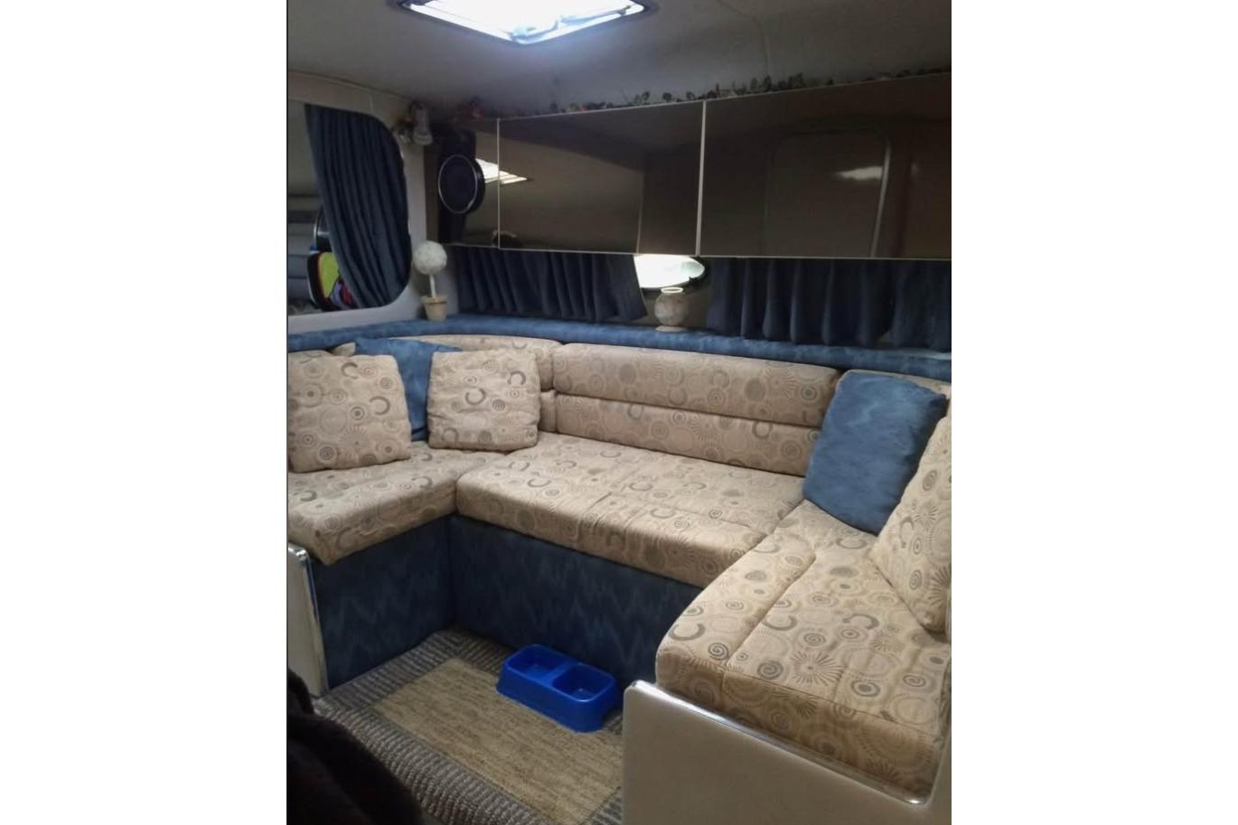 1992 Chaparral Signature 30 interior with patterned seating and blue accents.