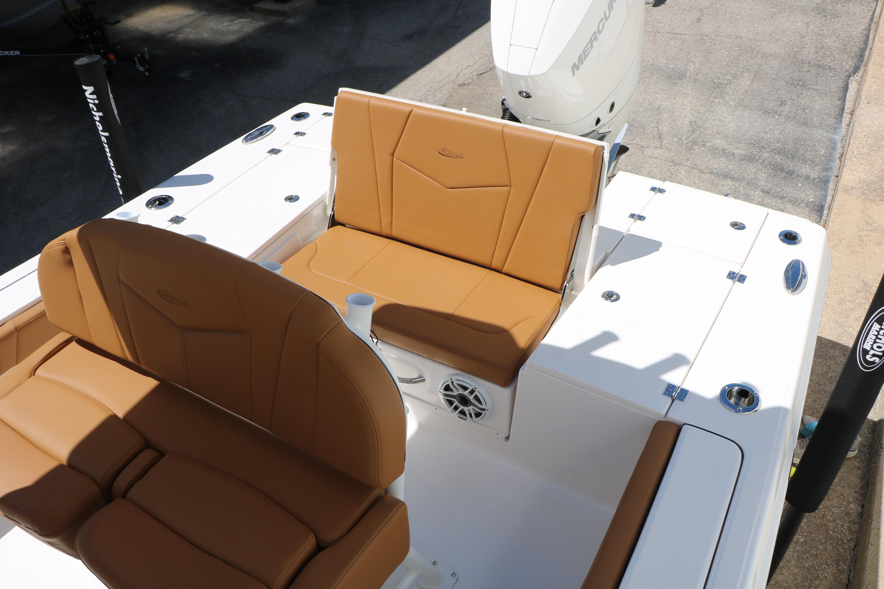 2026 Robalo 246 Cayman boat interior with tan seating and white deck.