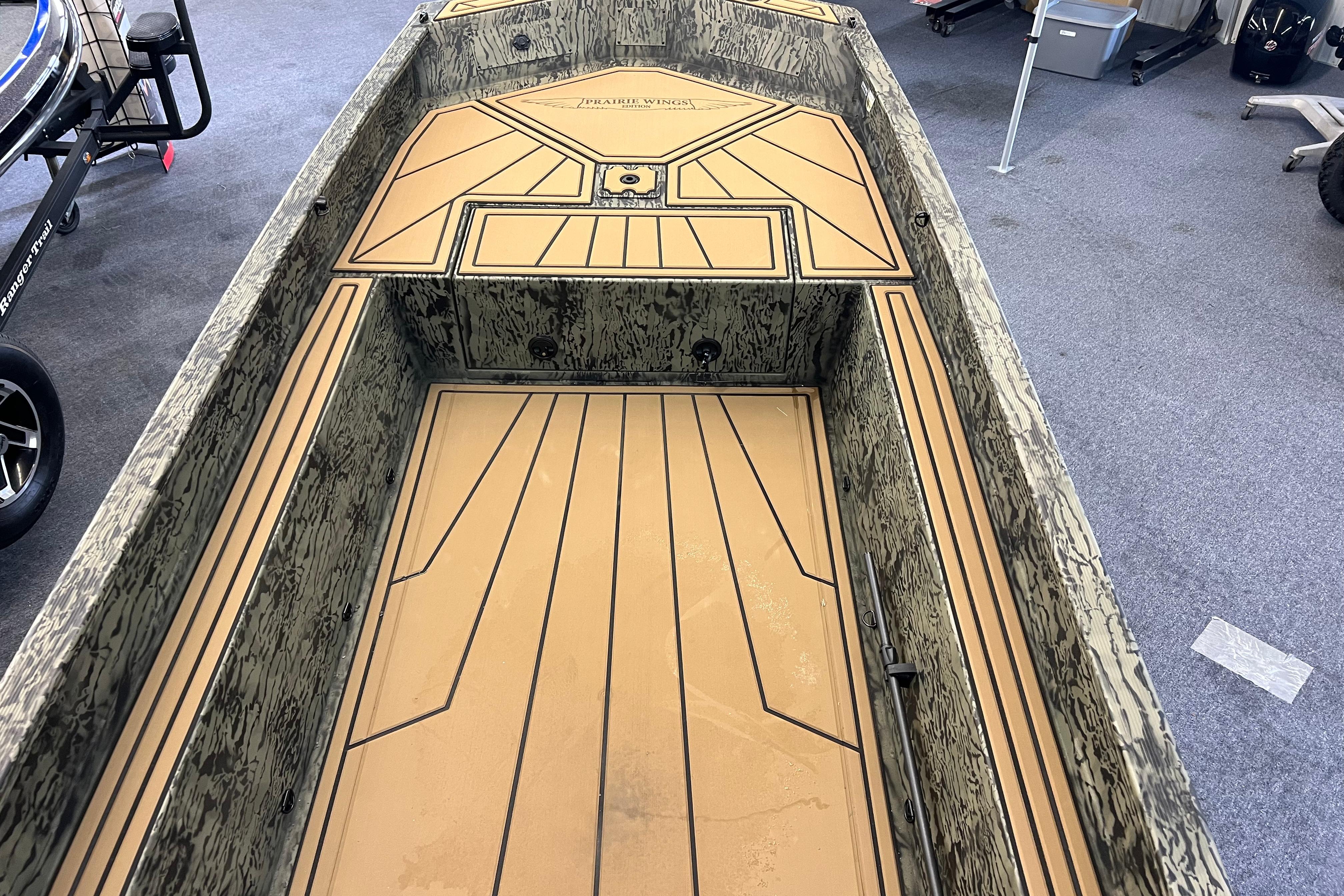 2026 Tracker Grizzly 1650 T Prairie Wings Edition boat interior with camouflage design.