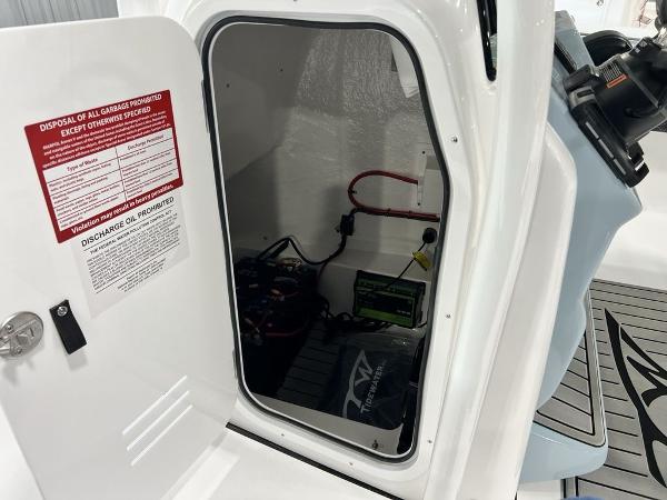 Open storage compartment in 2025 Tidewater 2300 Carolina Bay boat.