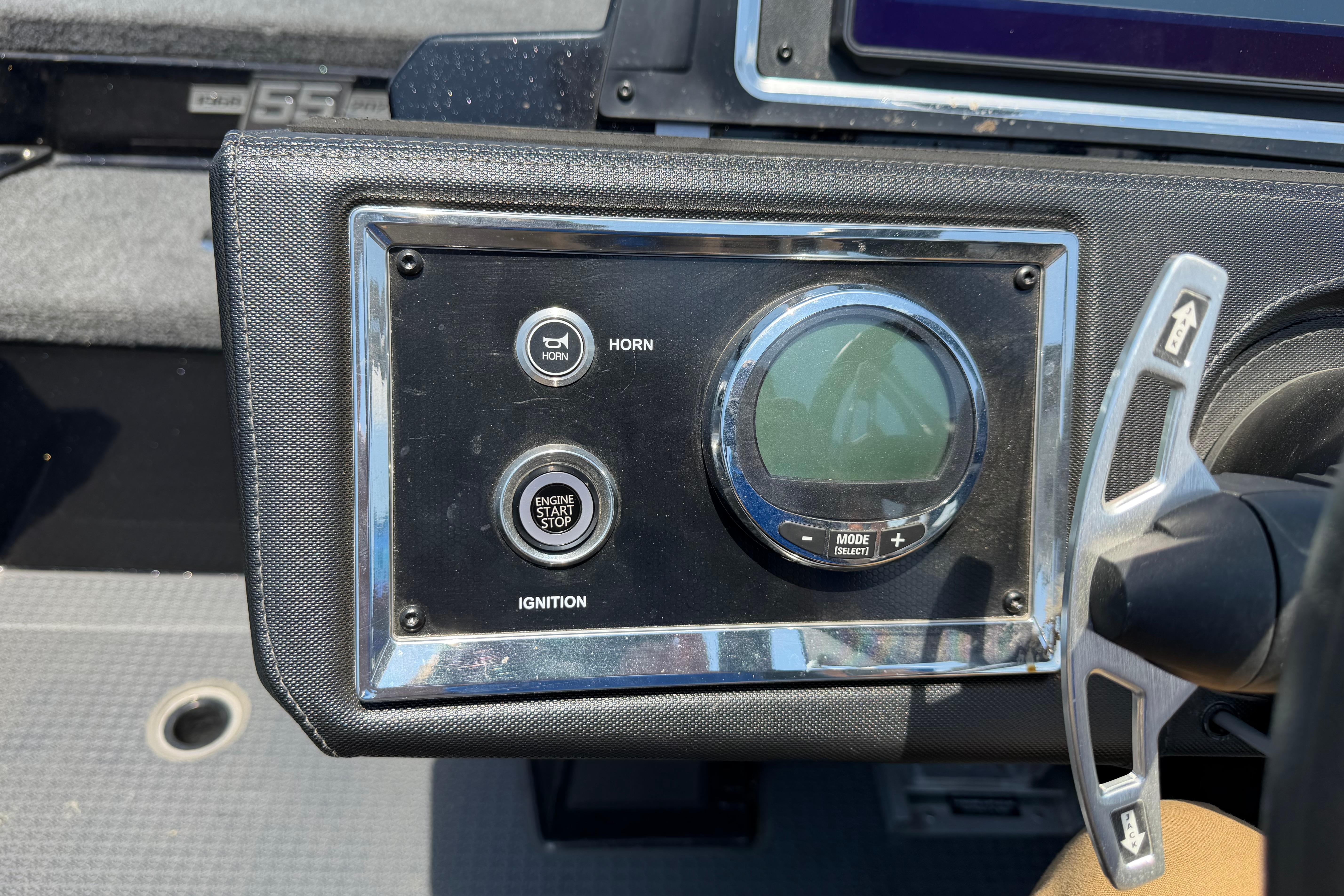 Dashboard of 2023 Ranger Z520R boat with ignition and horn controls.