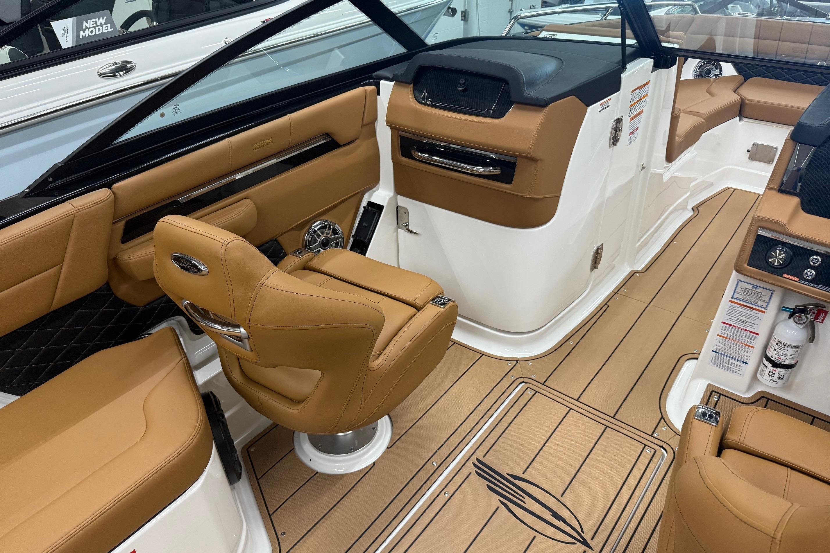 Interior of 2026 Chaparral SSX 6 boat with tan leather seating and modern dashboard.