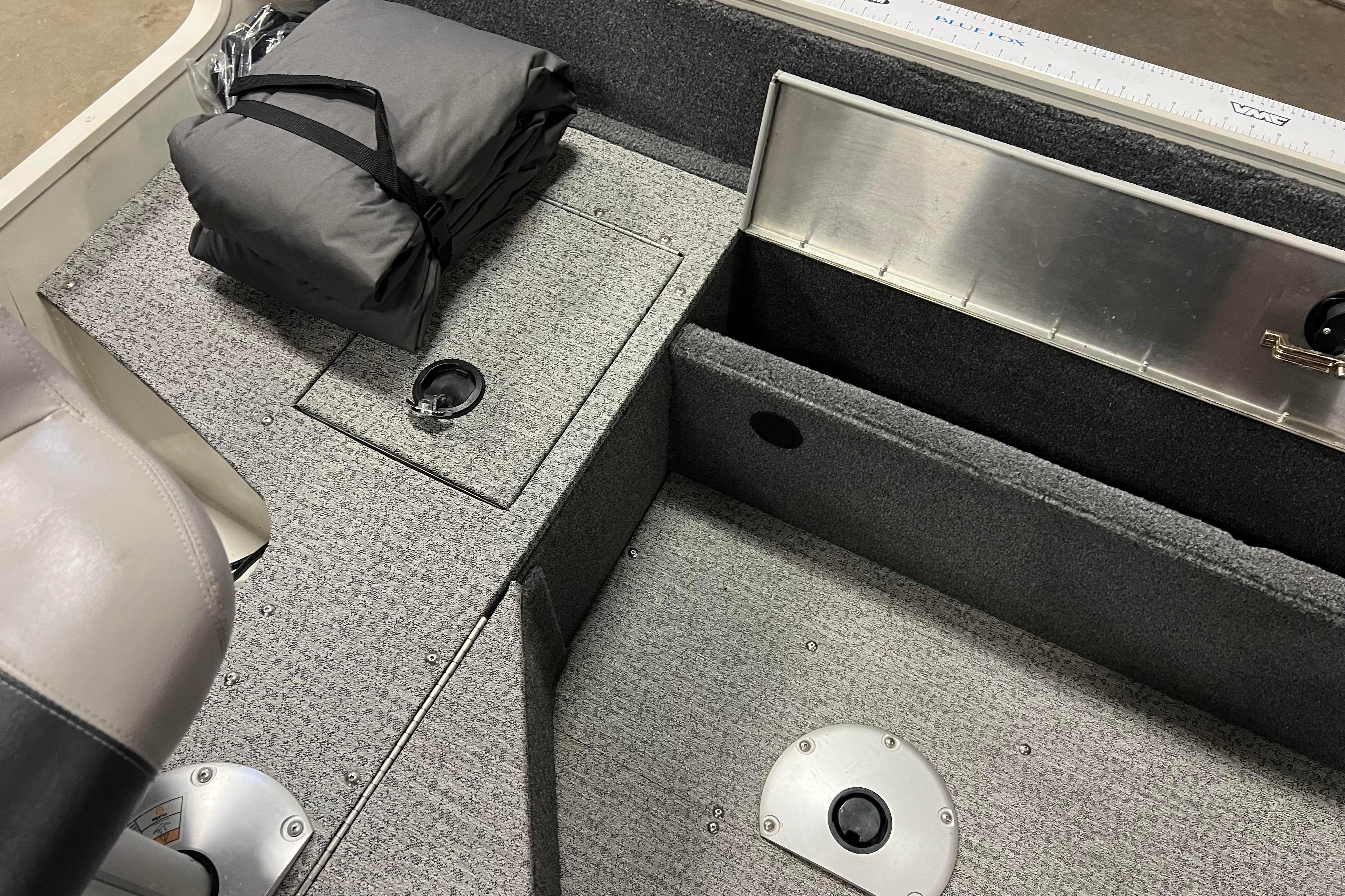 2022 Tracker Pro Guide V-16 WT boat interior with storage compartments and seating.