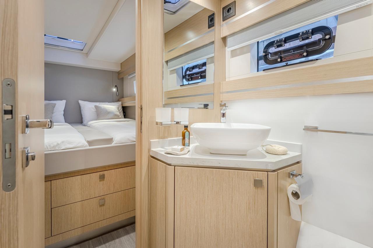 Luxurious bathroom and bedroom in Privilege Signature 510 yacht, year 2025.