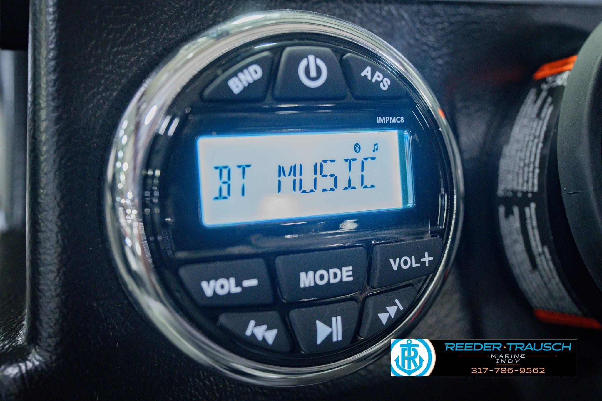 Audio control panel displaying "BT Music" in a 2026 Lund 1775 Impact XS boat.