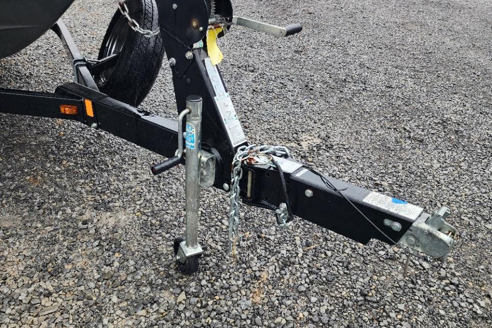 Trailer hitch of a 2015 Yamaha Boats 212X on gravel surface.