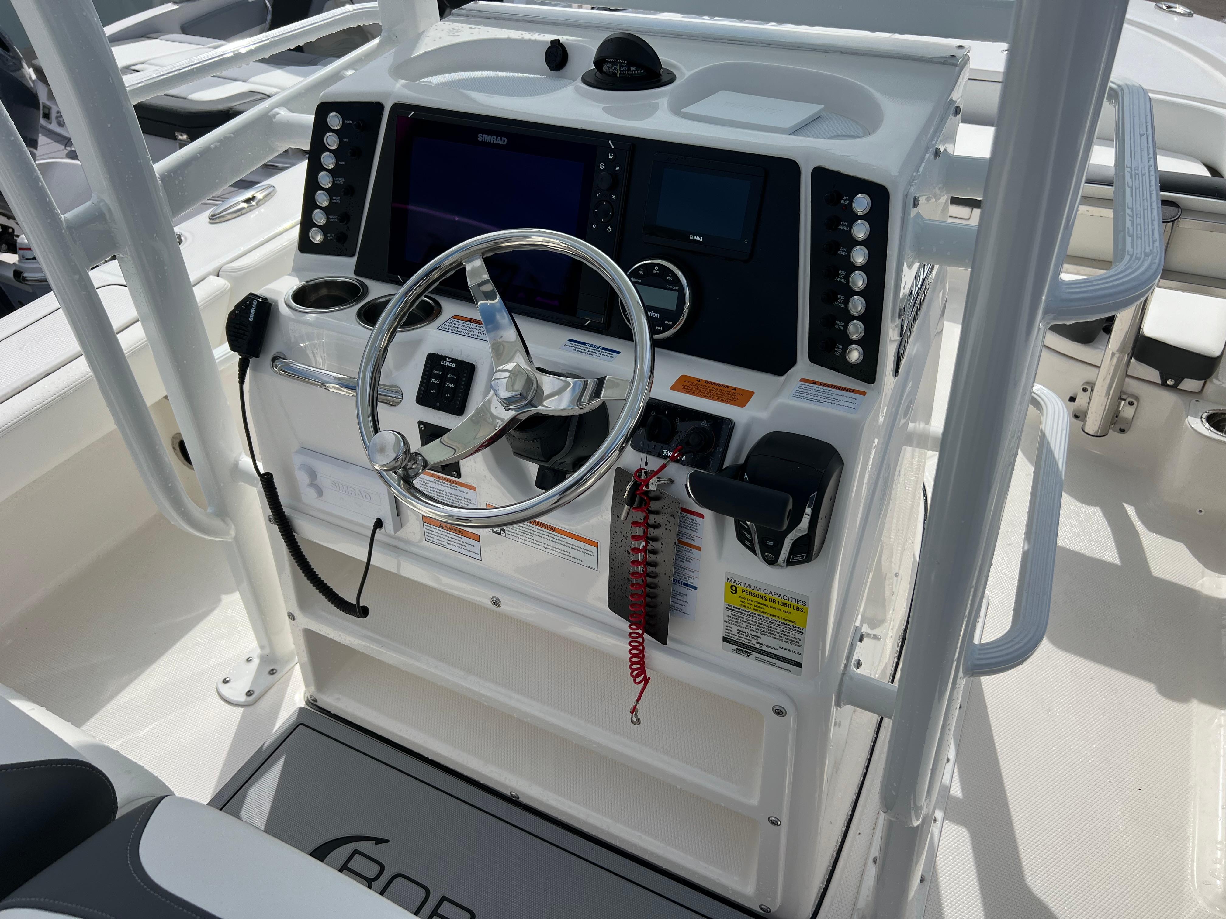 2024 Robalo 246 Sky Deck boat helm with modern controls and navigation system.