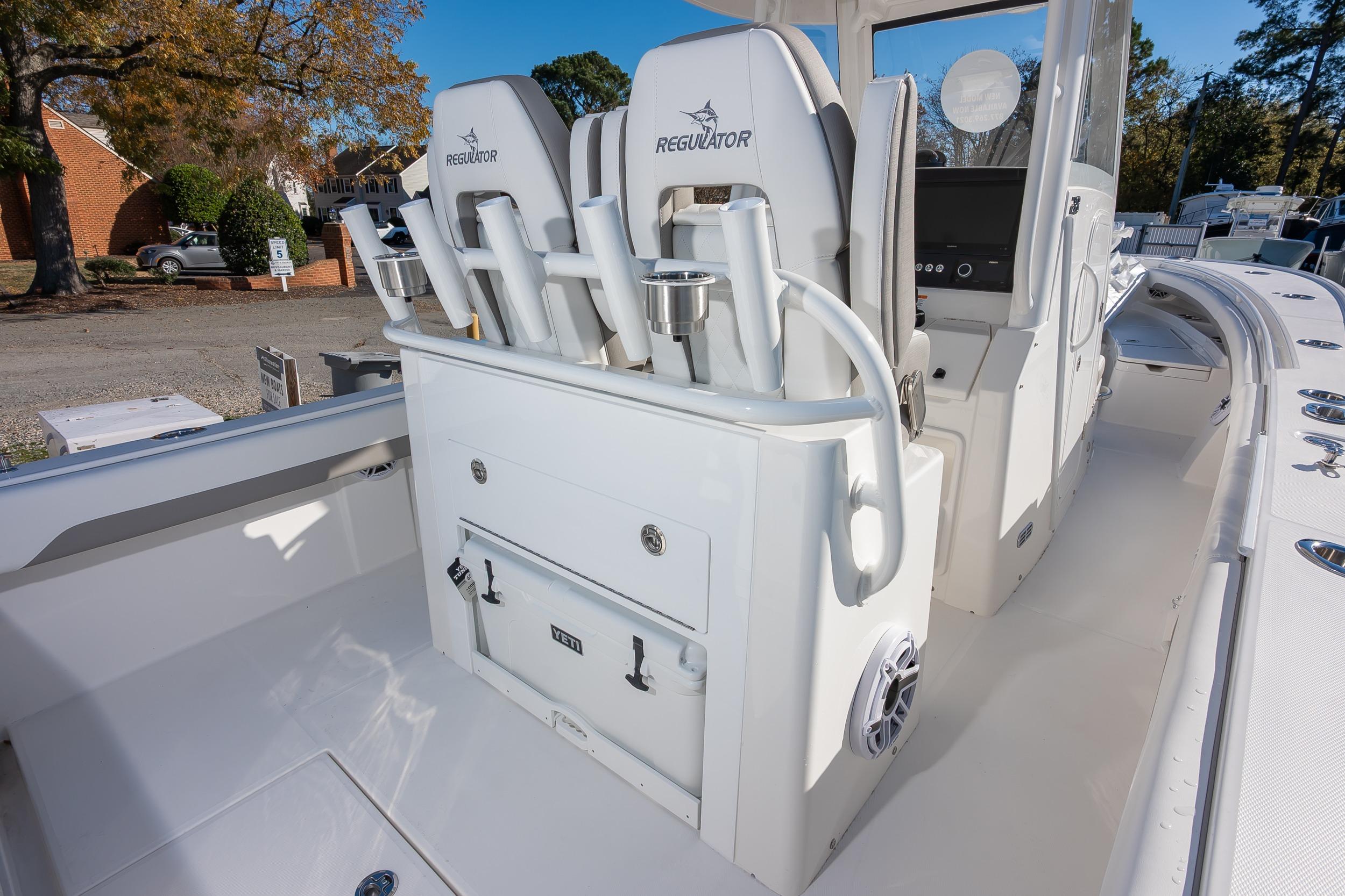 2026 Regulator 28 boat interior with seating, rod holders, and storage compartments.