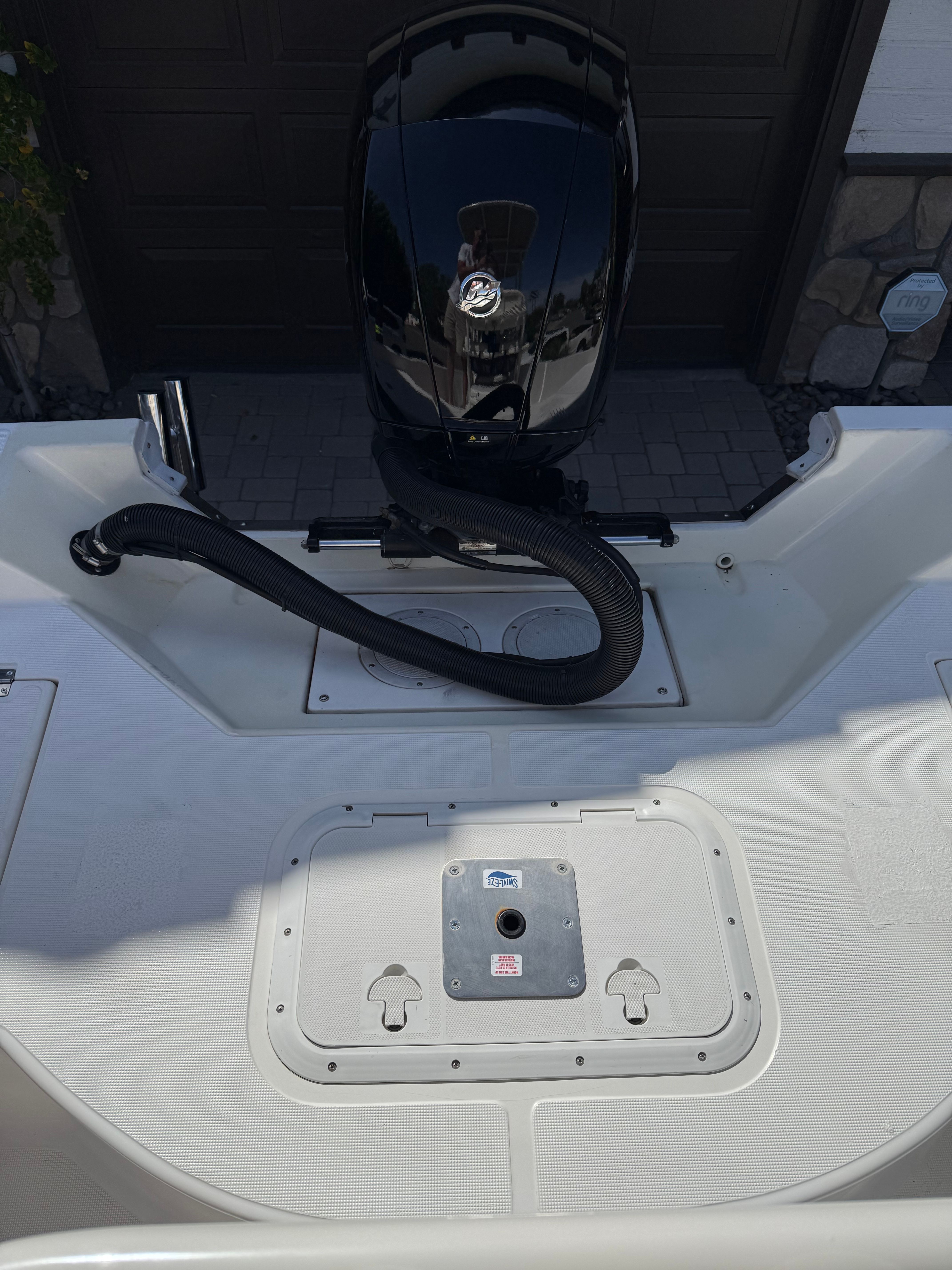1998 Robalo 2100 Bay Hunter with outboard motor, rear view.