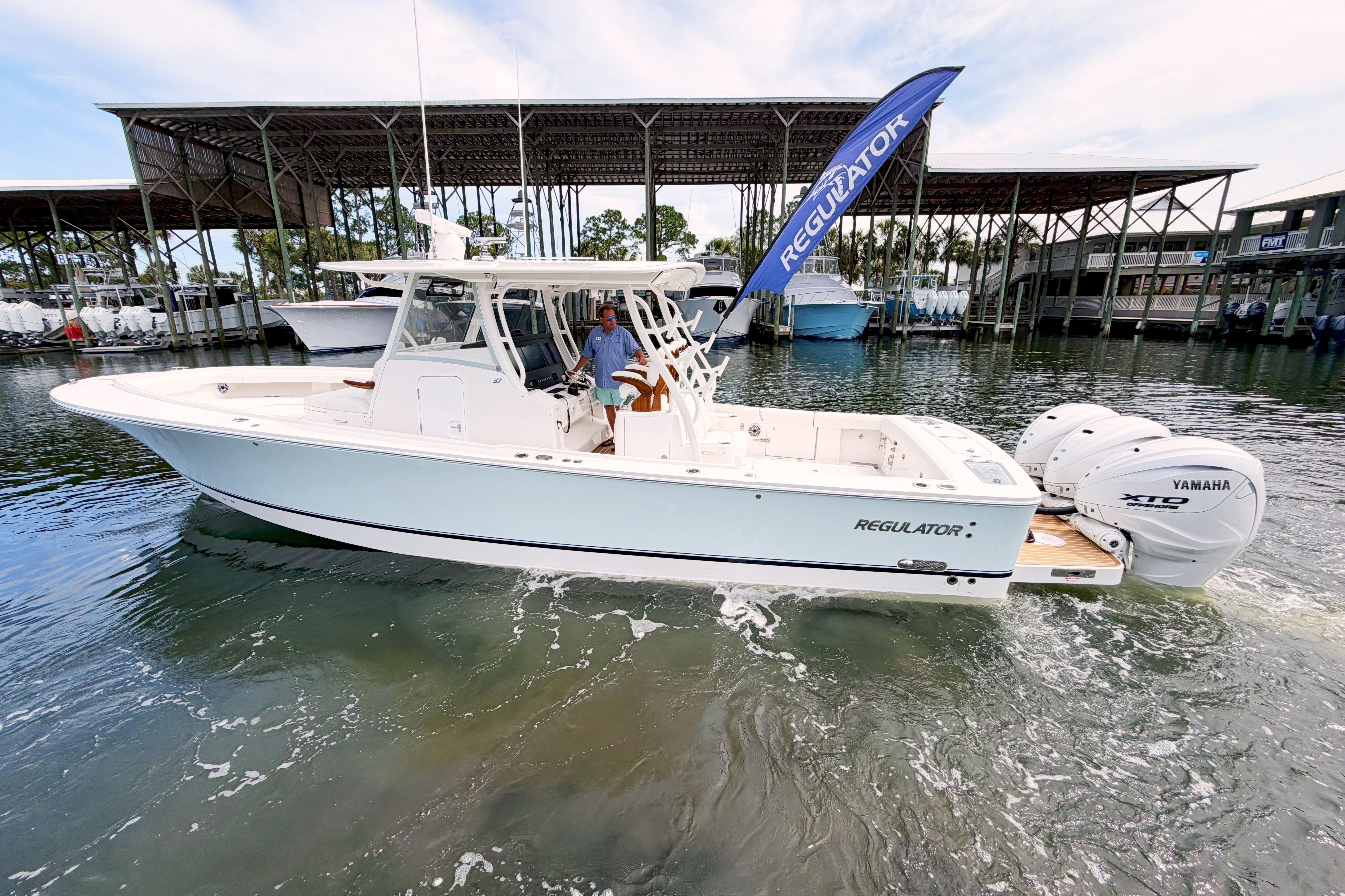 2026 Regulator 37 boat with Yamaha engines on a calm marina.