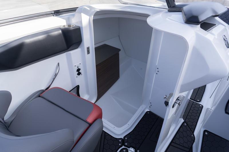 2026 Scarab 255 LX Wake boat interior with seating and storage compartment.