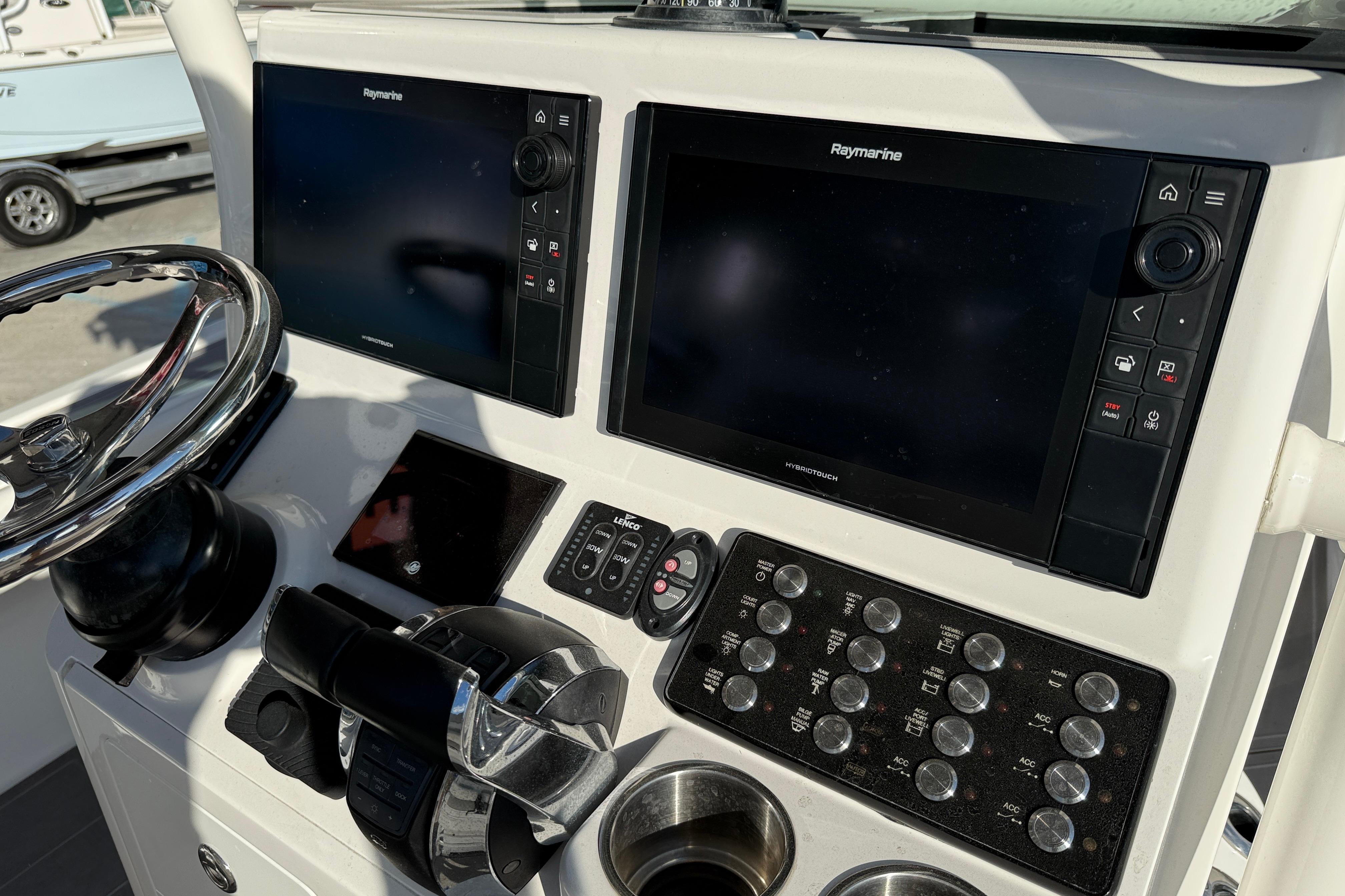 Control panel of 2022 Caymas 28 HB Twin boat with dual Raymarine displays.