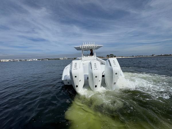 2025 Yellowfin 39 Offshore boat with triple outboard engines cruising on open water.