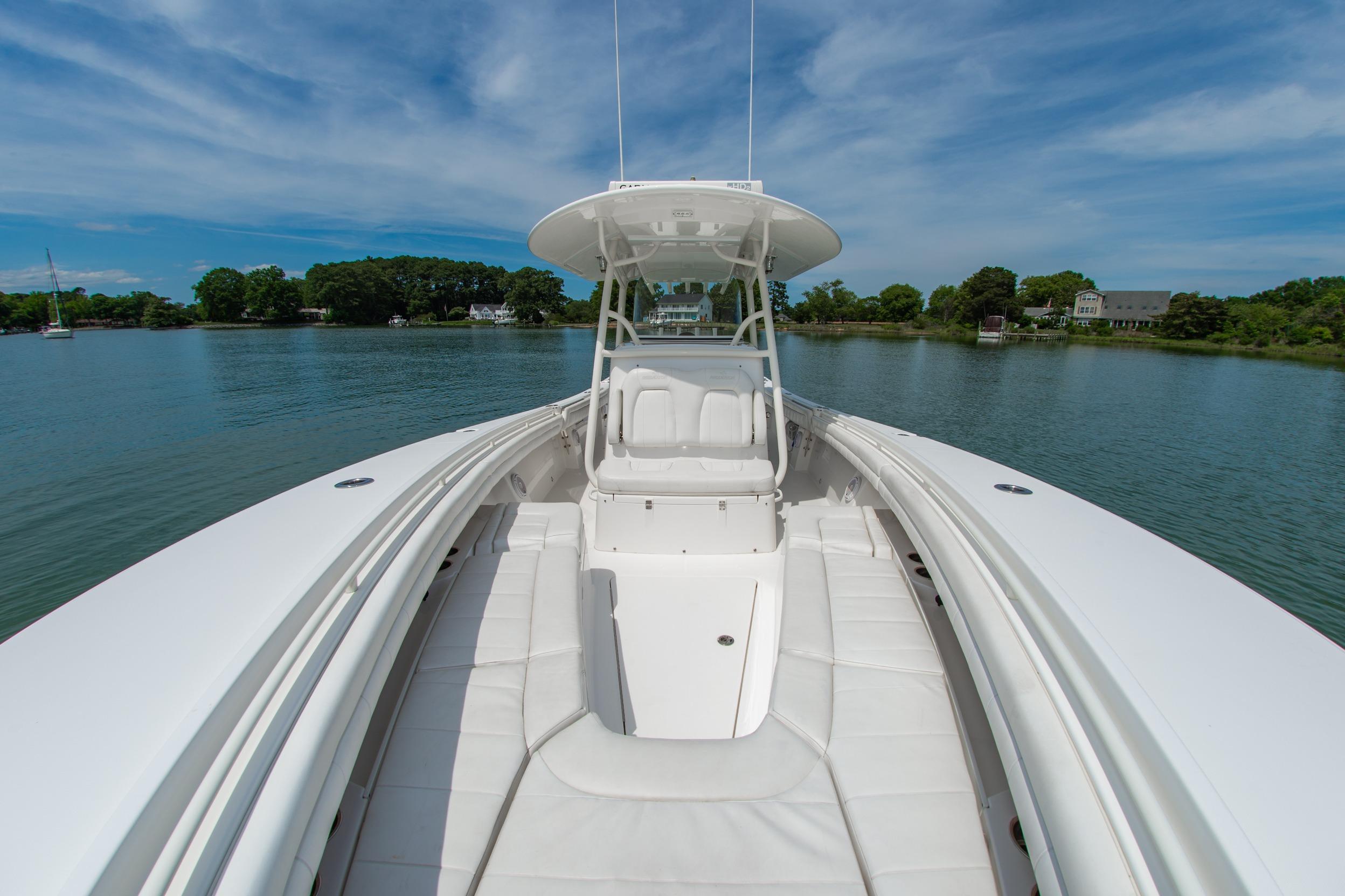 2019 Regulator 31 boat on calm water, featuring spacious seating and sleek design.