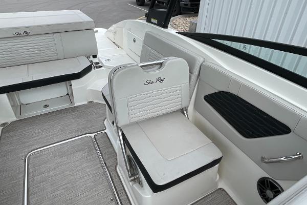 2023 Sea Ray SPX 230 boat interior with white seating and modern design.