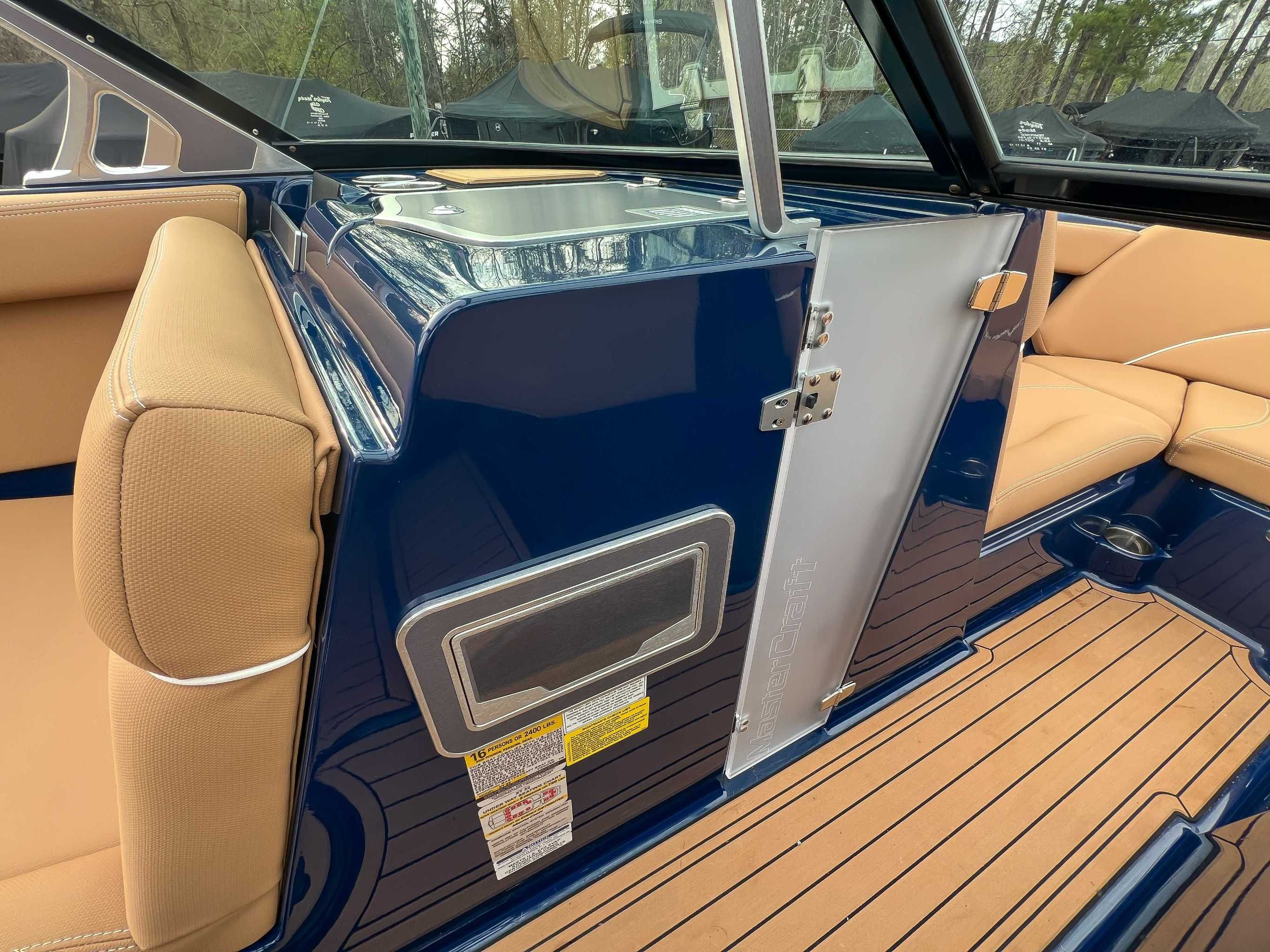 Interior of a 2021 MasterCraft XT22 with blue and beige seating.