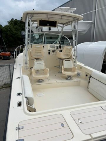 The image shows a 2008 Parker 2310 Walkaround boat with two seats and a helm station.