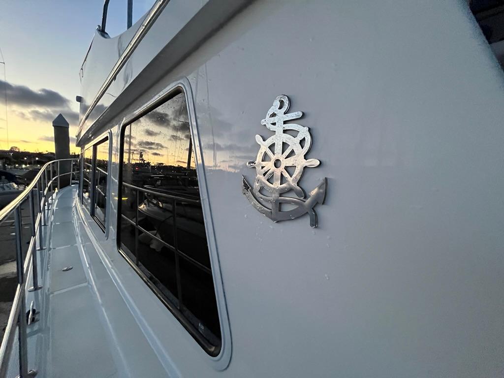 Bracewell 41 yacht, 2025 model, docked at sunset with nautical emblem.