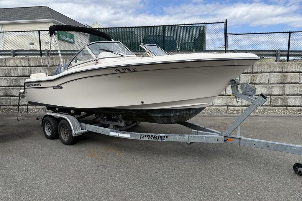 2019 Grady-White Freedom 215 boat on trailer, parked outdoors.