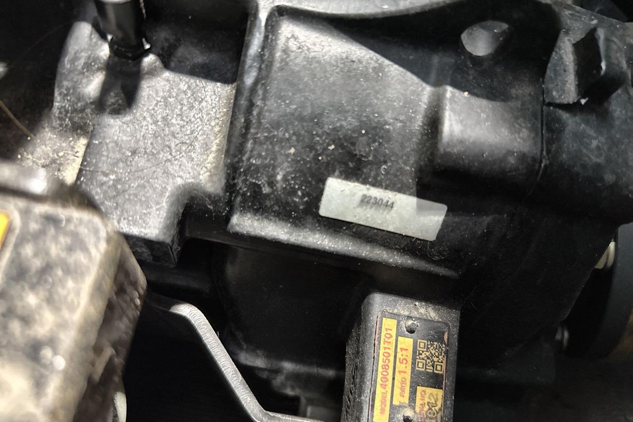 Close-up of a 2021 Supra SE 550 engine component with visible labels.