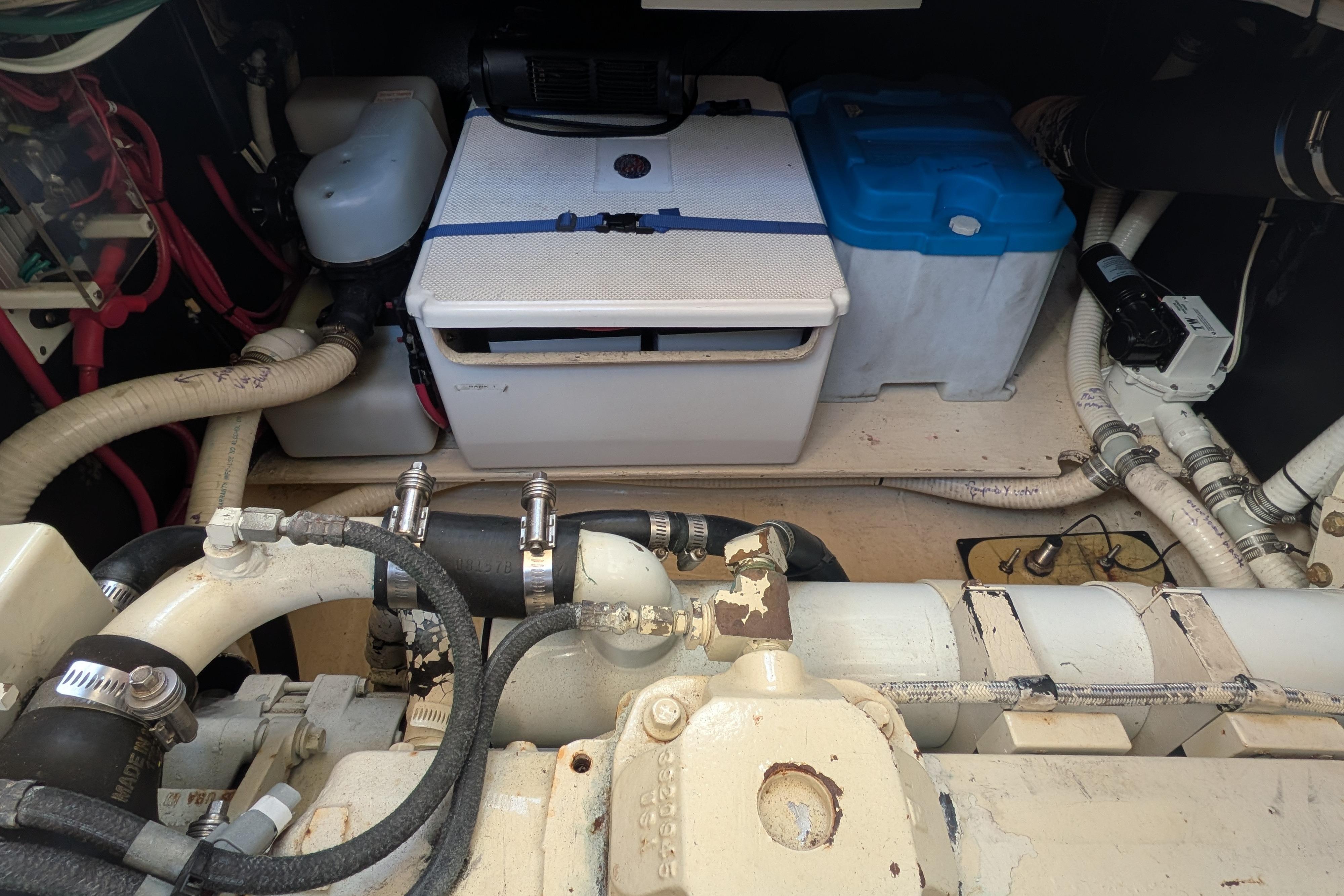 Engine room of a 1998 Nordic Tug 32 with visible components and piping.