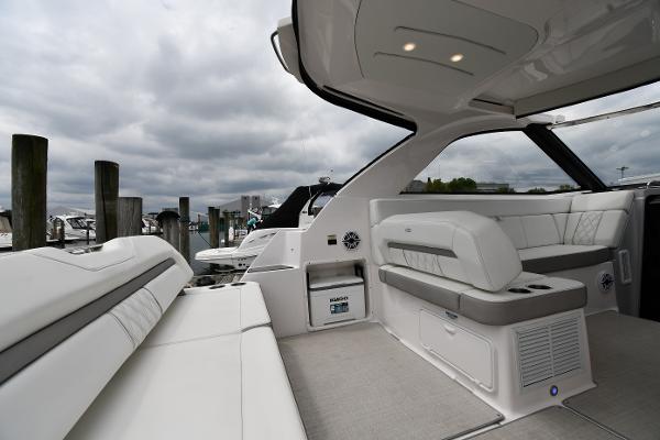 2021 Regal 35 Sport Coupe interior with plush seating and modern design at a marina.