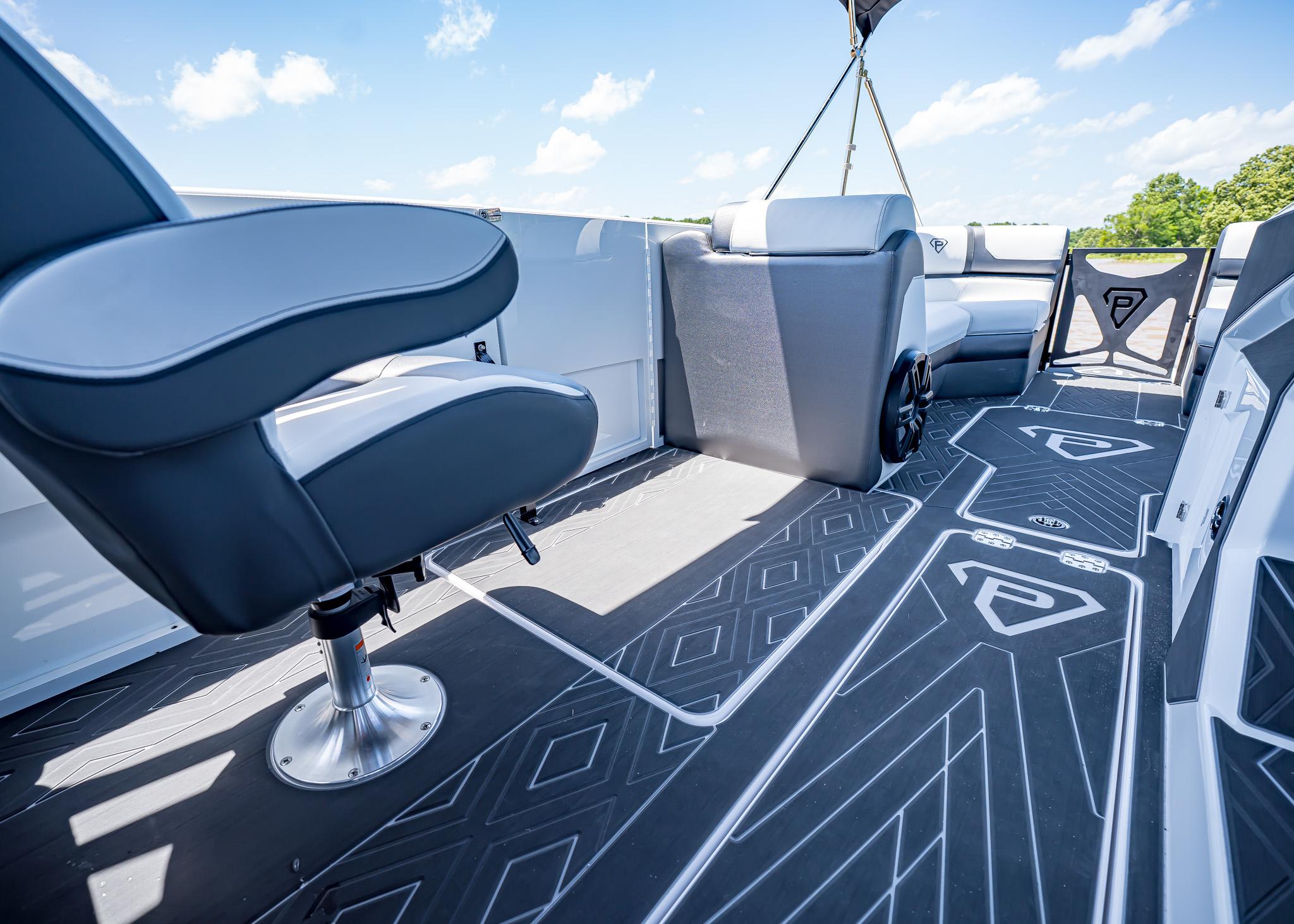 Interior of 2025 Paradigm Damascus 266 Surf boat with modern seating and flooring.