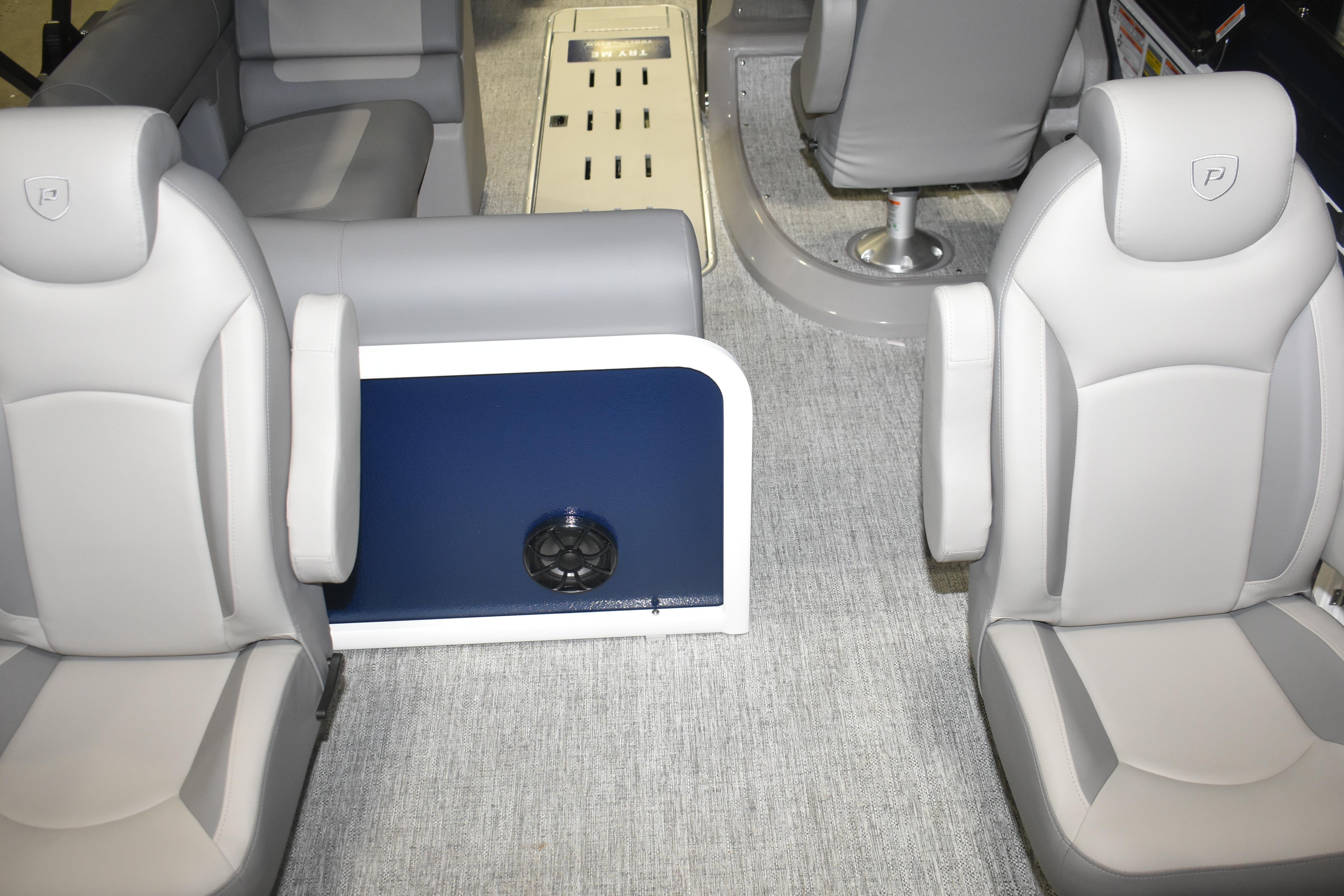 Interior of 2026 Premier 230 Sunsation Angler 4PT boat with gray seating and carpet.