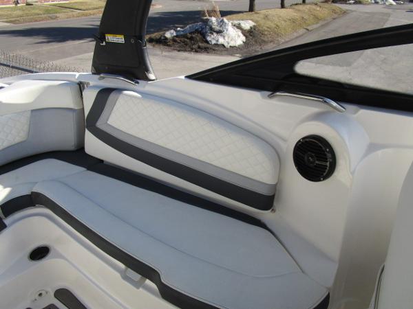Interior of a 2017 Larson 292 LXI boat with white and gray seating.