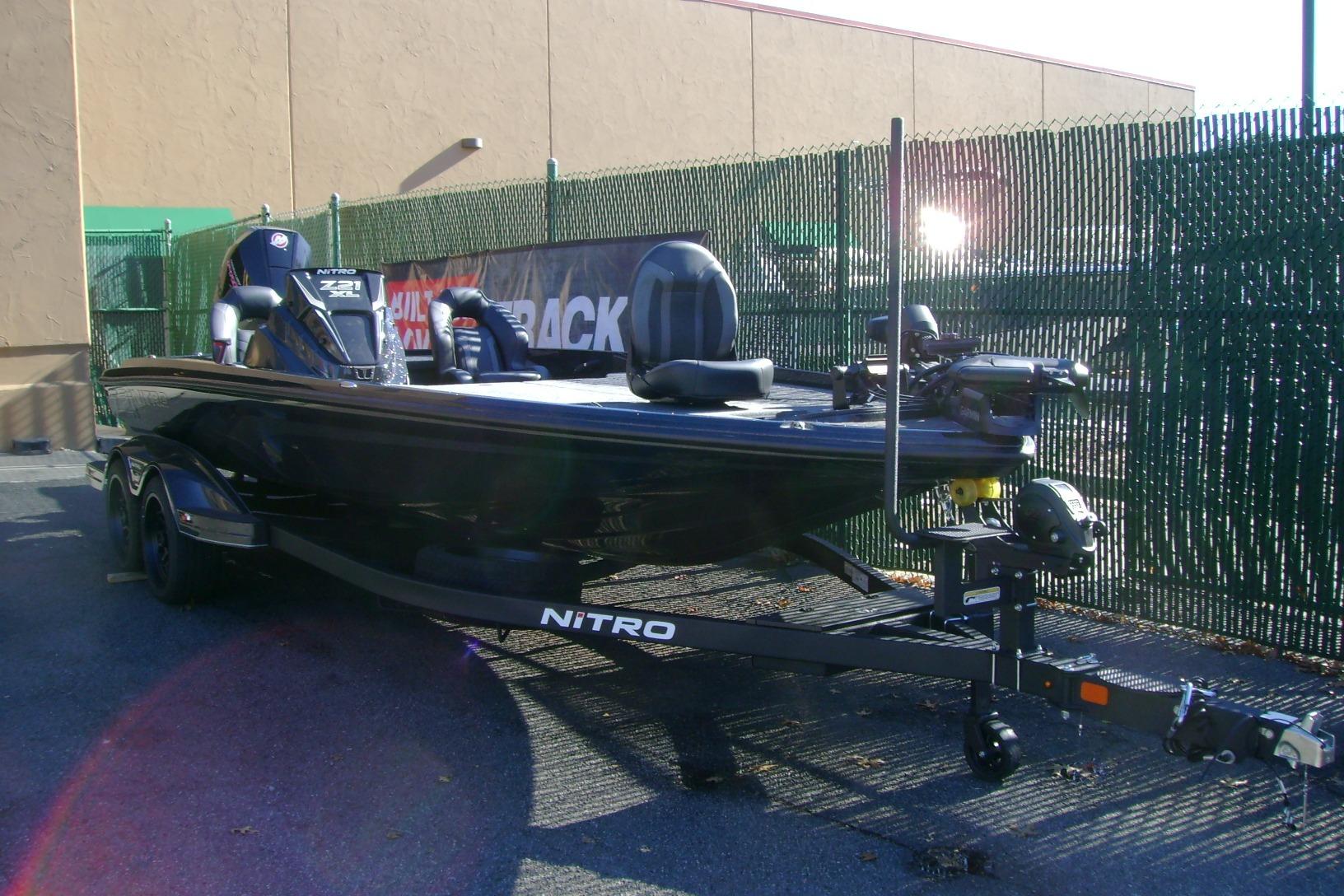 2026 Nitro Z21 XL Pro bass boat on trailer, parked outdoors.
