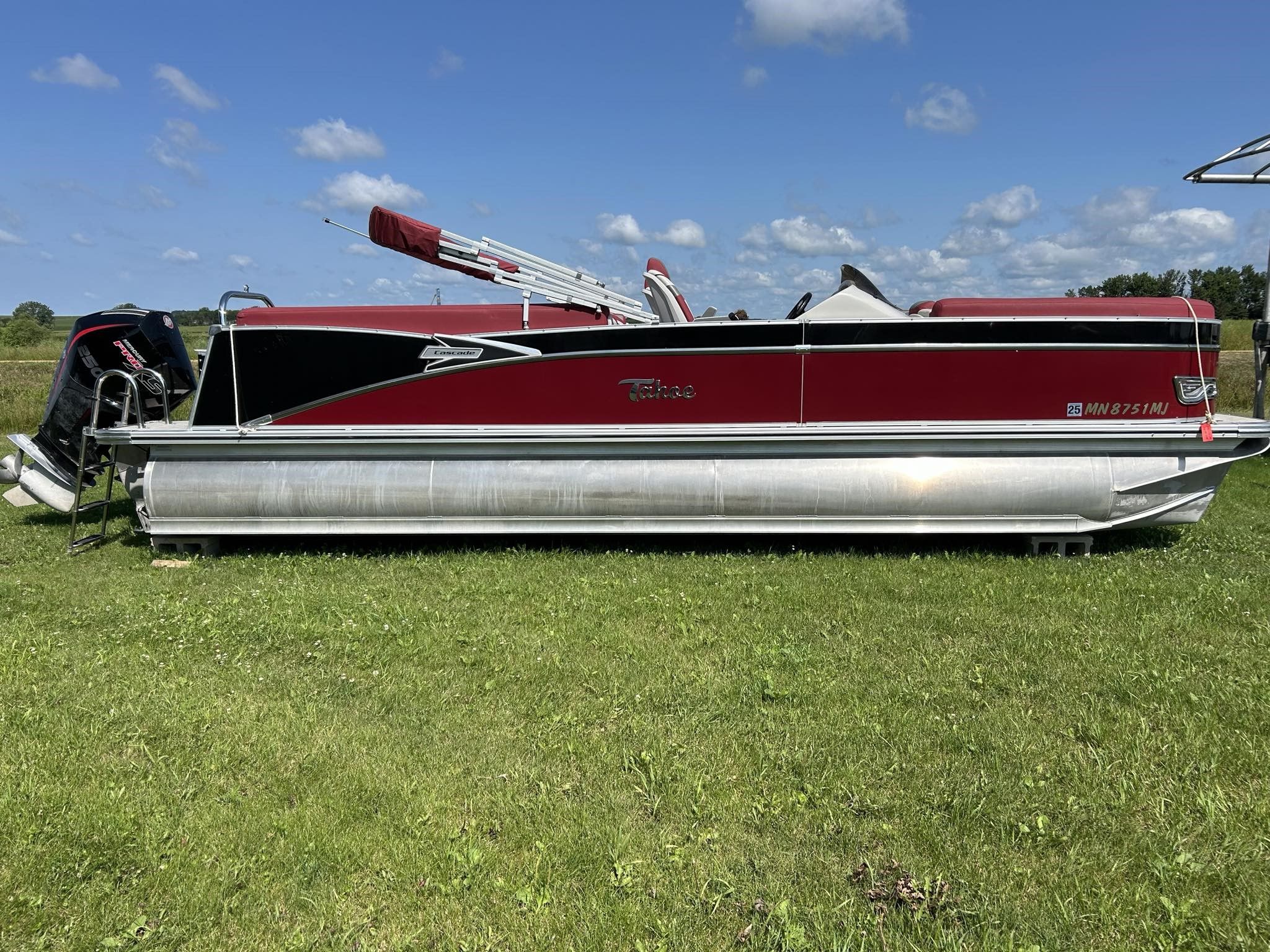 2023 Tahoe Pontoon Cascade Quad Lounger on green grass.