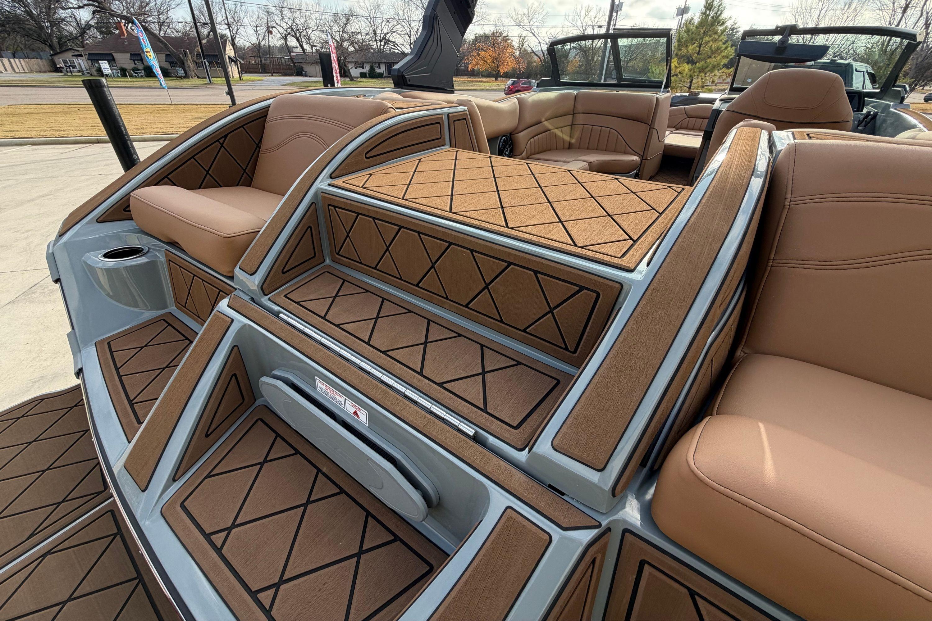 2026 MB B52 21 Alpha boat interior with tan seating and stylish deck design.