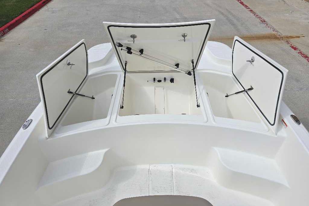 2026 Mako Pro Skiff 19 CC boat with open storage compartments on deck.