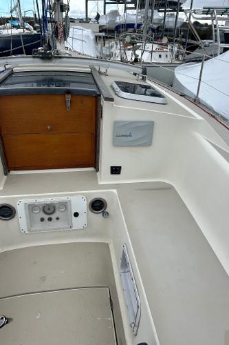 1983 O'Day 39 sailboat cockpit with wooden hatch and control panel.