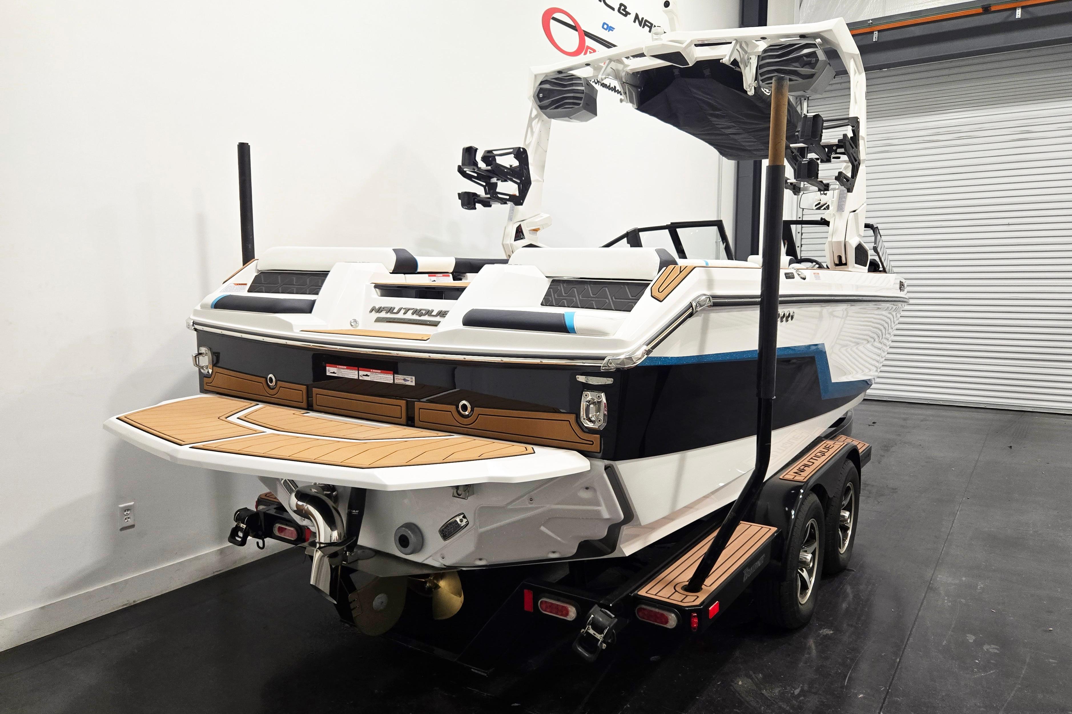 2026 Nautique Super Air Nautique GS22 boat on trailer in garage setting.
