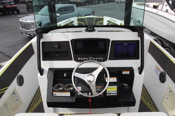 2023 Scarab 255 Open ID boat dashboard with steering wheel and controls.