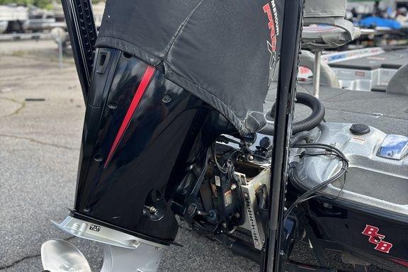 2020 Bass Cat Cougar FTD boat engine close-up with protective cover.