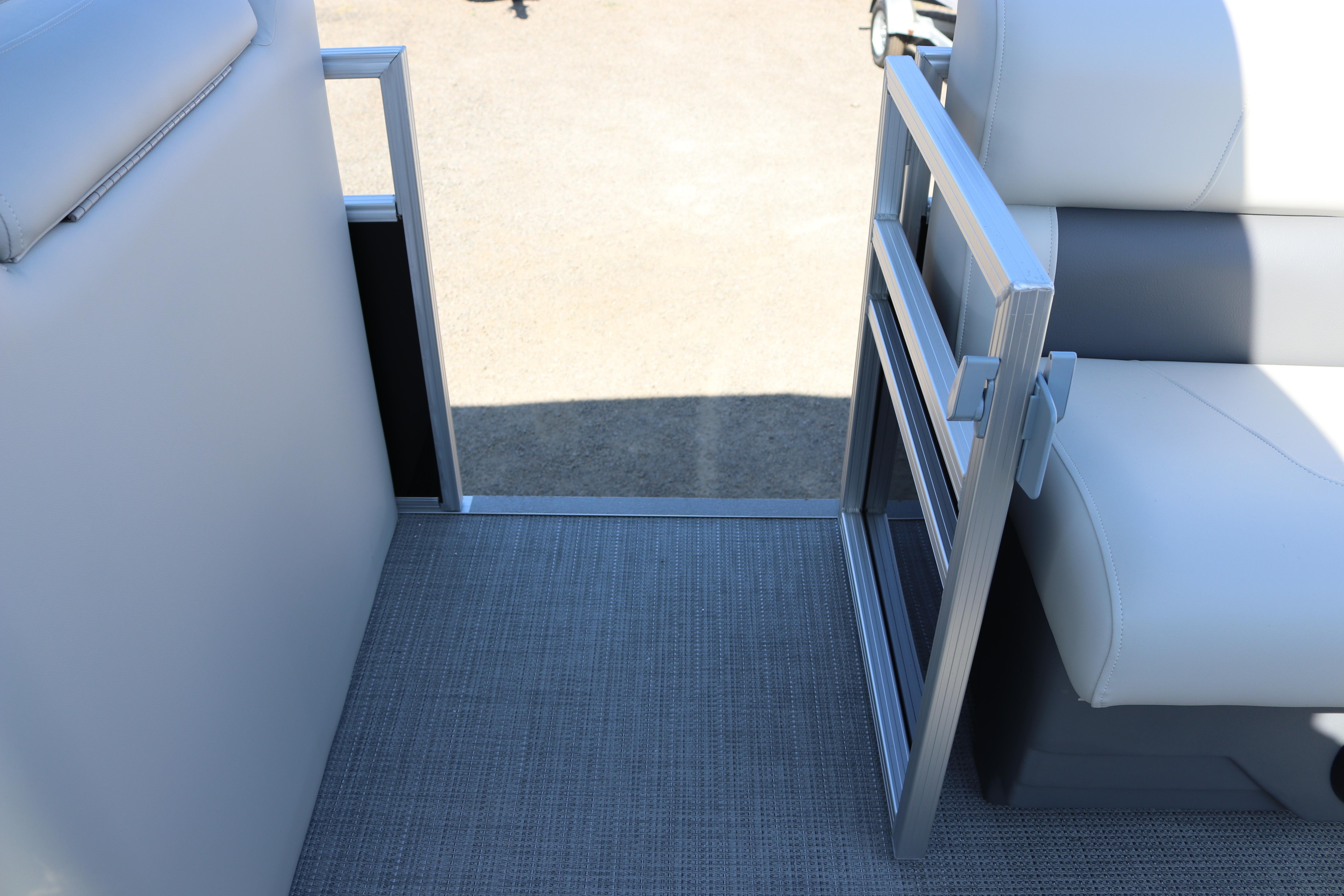 Interior view of 2025 SunChaser Vista 20 Fish pontoon boat with seating and open gate.
