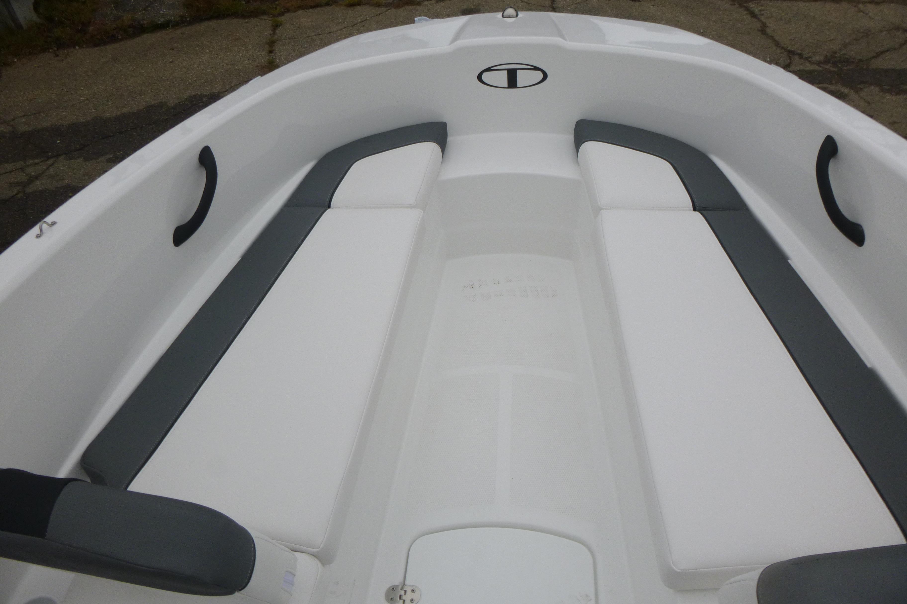2026 Tahoe T16 boat interior with white and gray seating, featuring sleek design and comfortable layout.