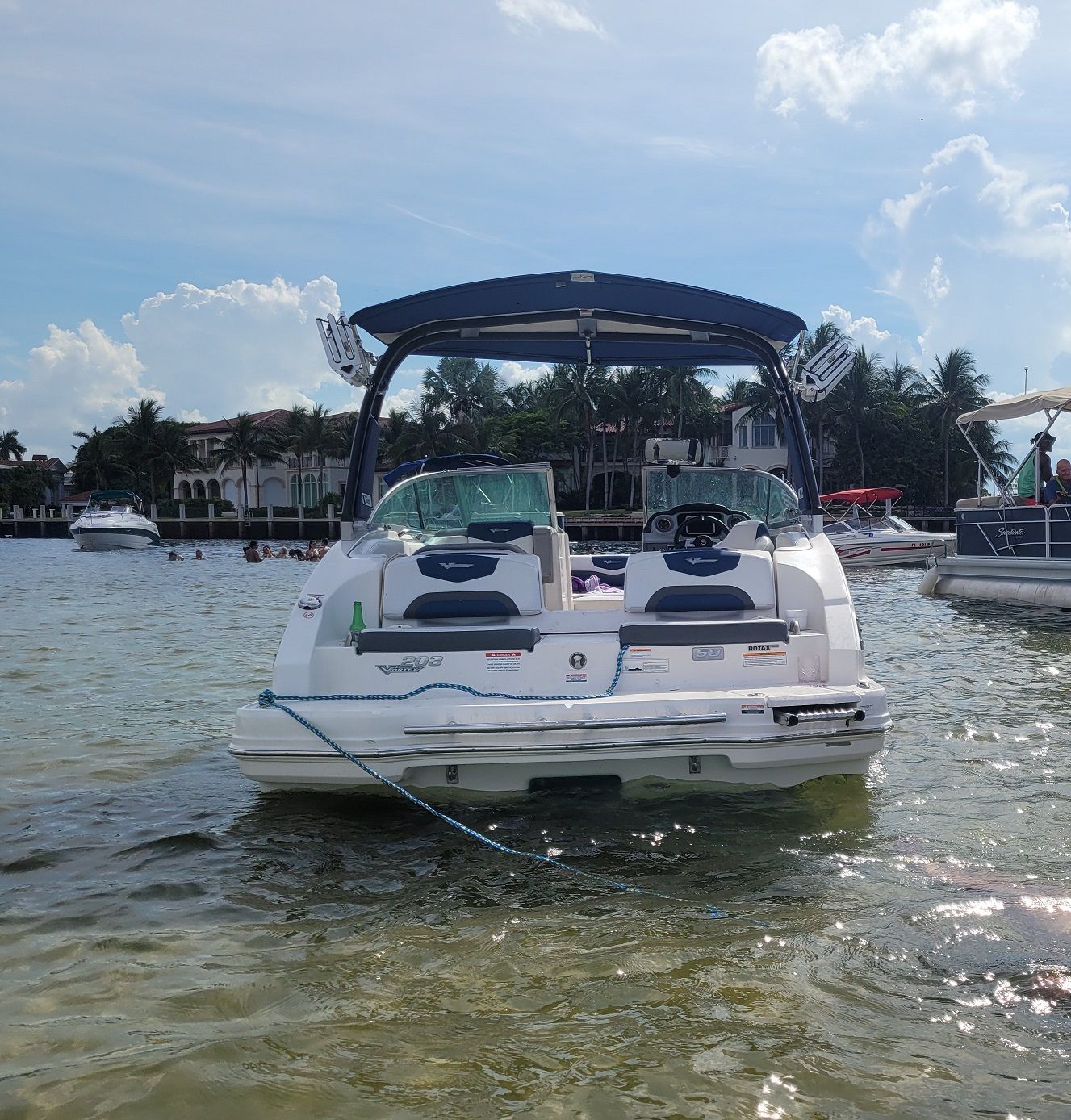 2015 Chaparral 203VR boat parked on water.