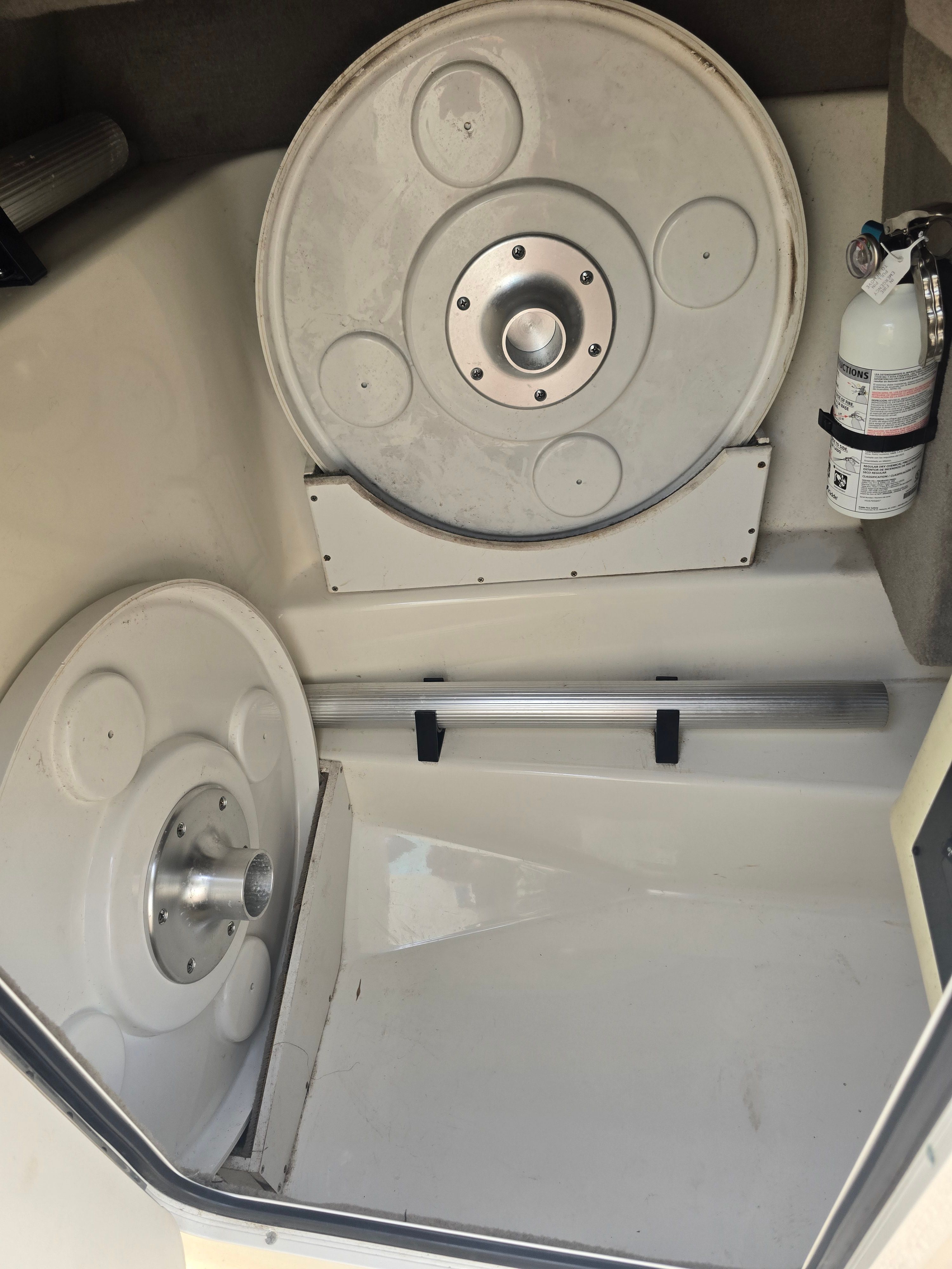 Interior of a 2007 Sea Ray 270 Select EX boat with fire extinguisher.