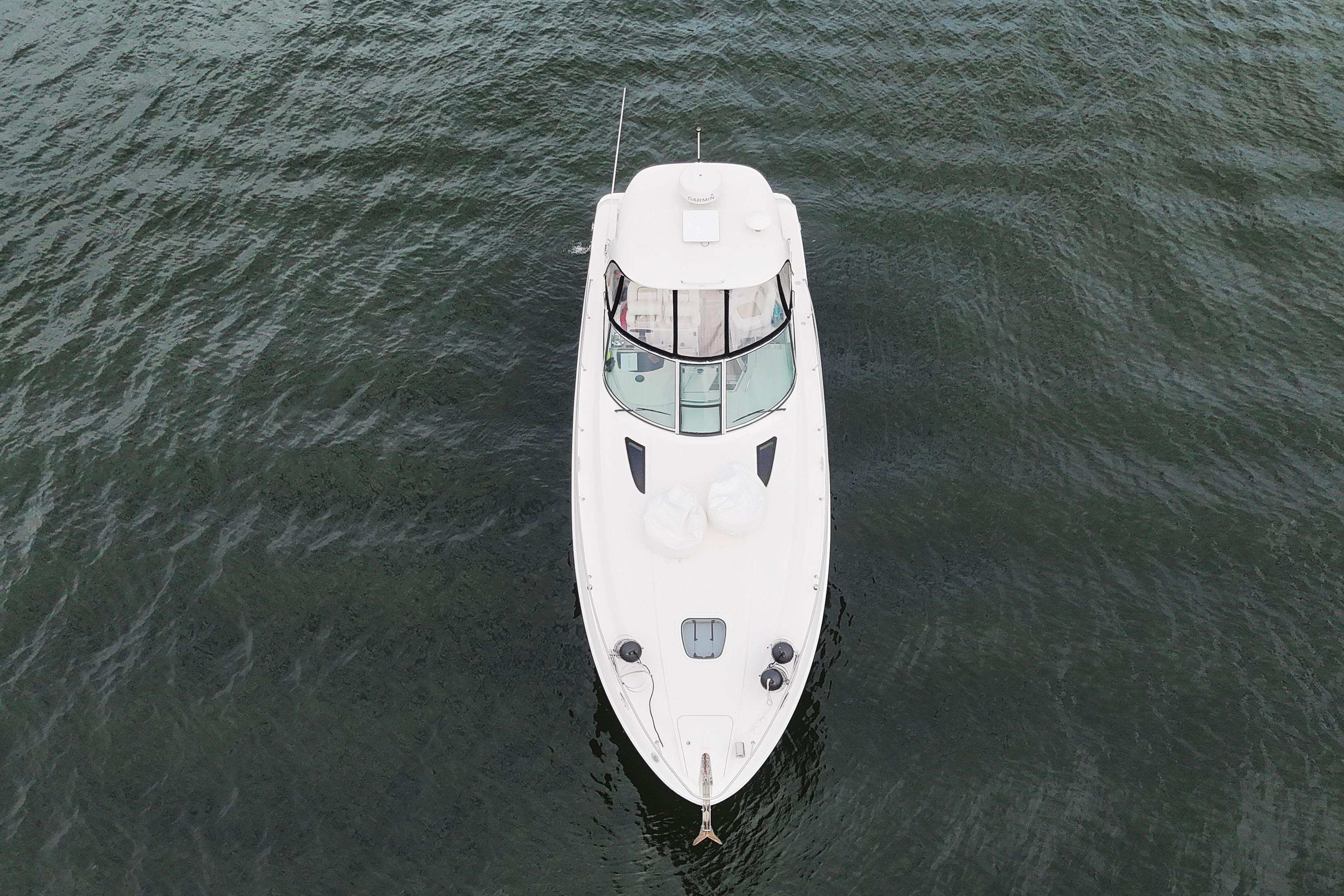 Aerial view of 2009 Sea Ray Sundancer 350 yacht on calm water.