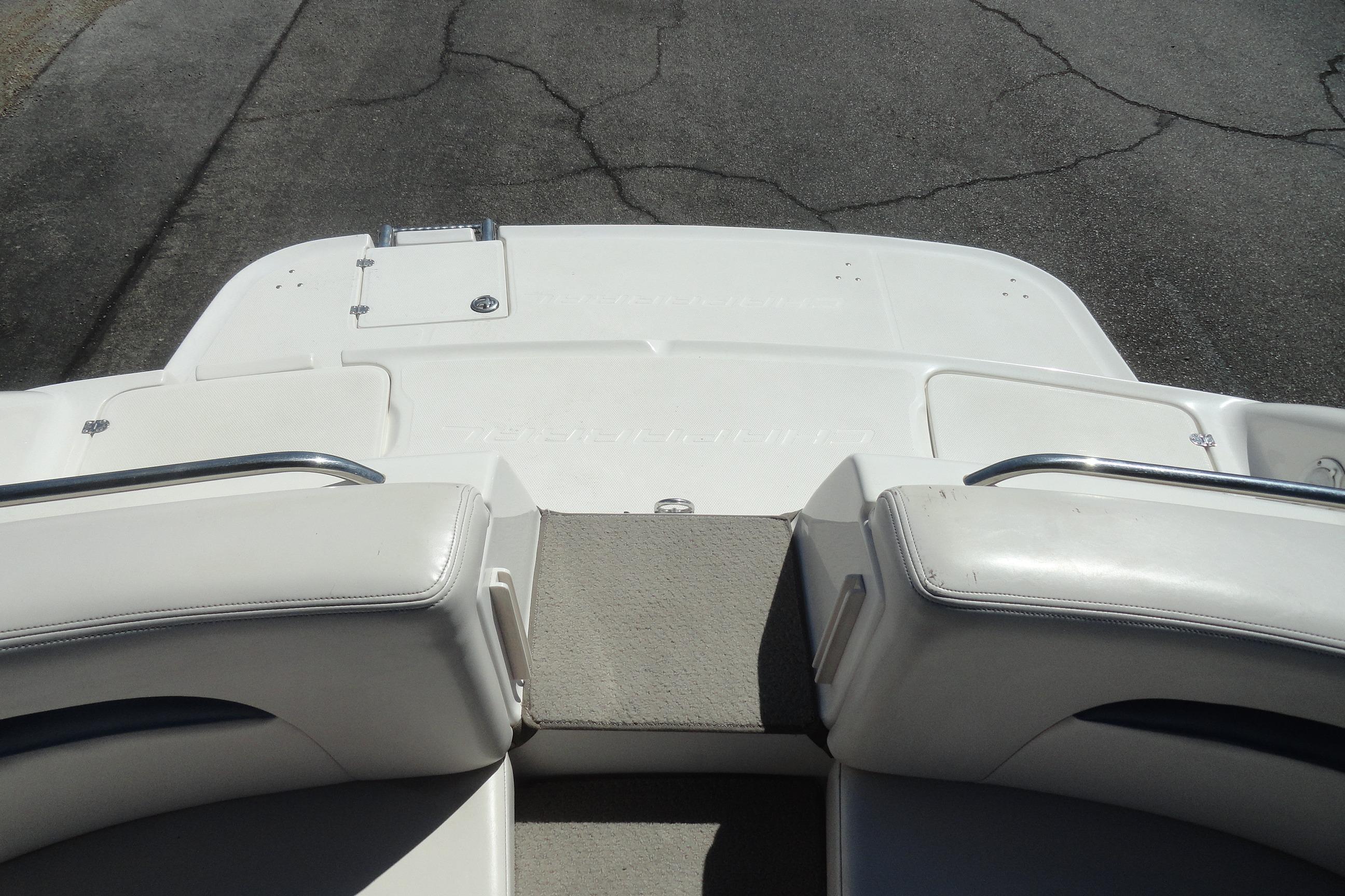 2001 Chaparral 265 SSi boat interior, featuring white seating and a swim platform.