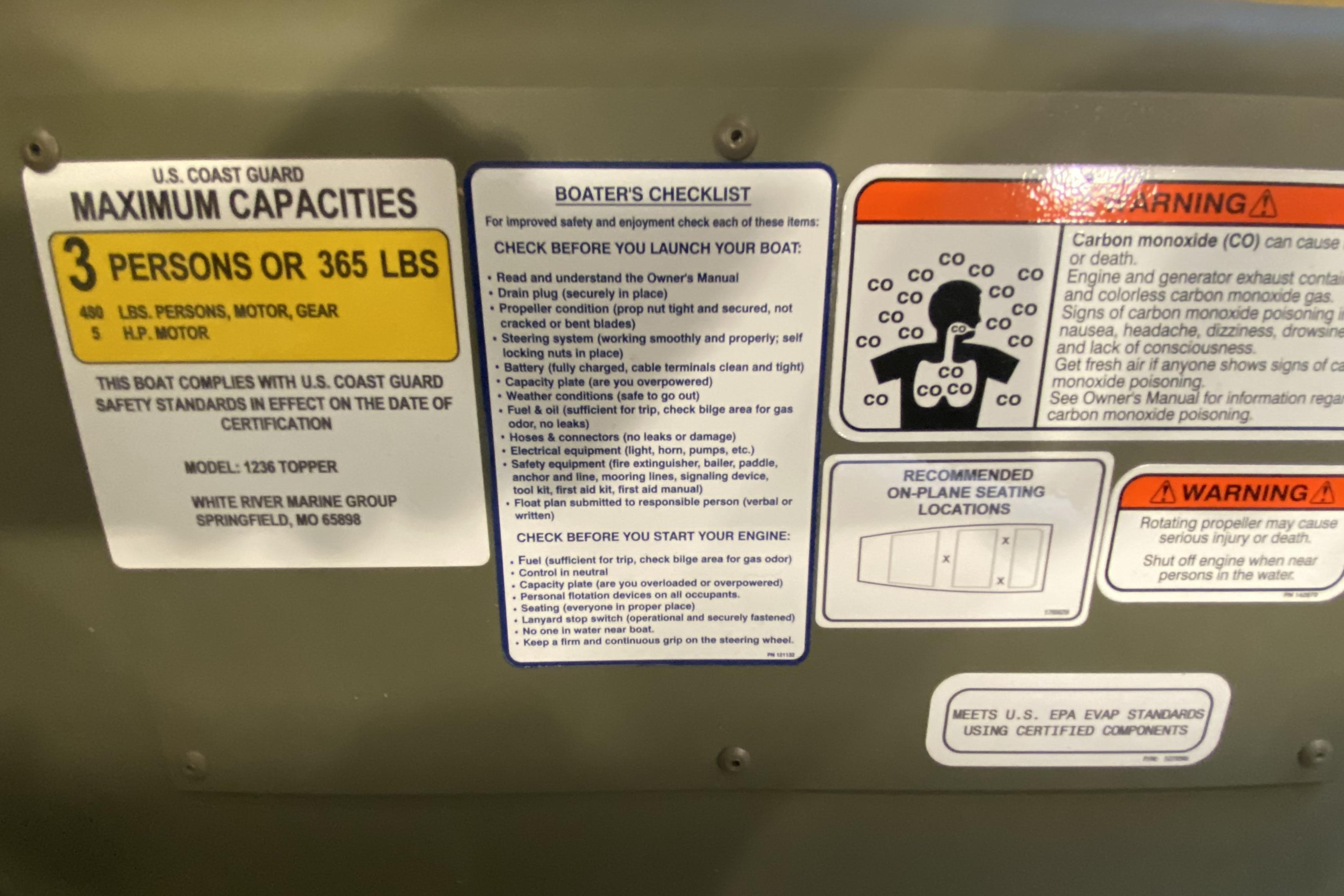 Safety and capacity labels on a 2026 Tracker Grizzly 12 Jon boat.