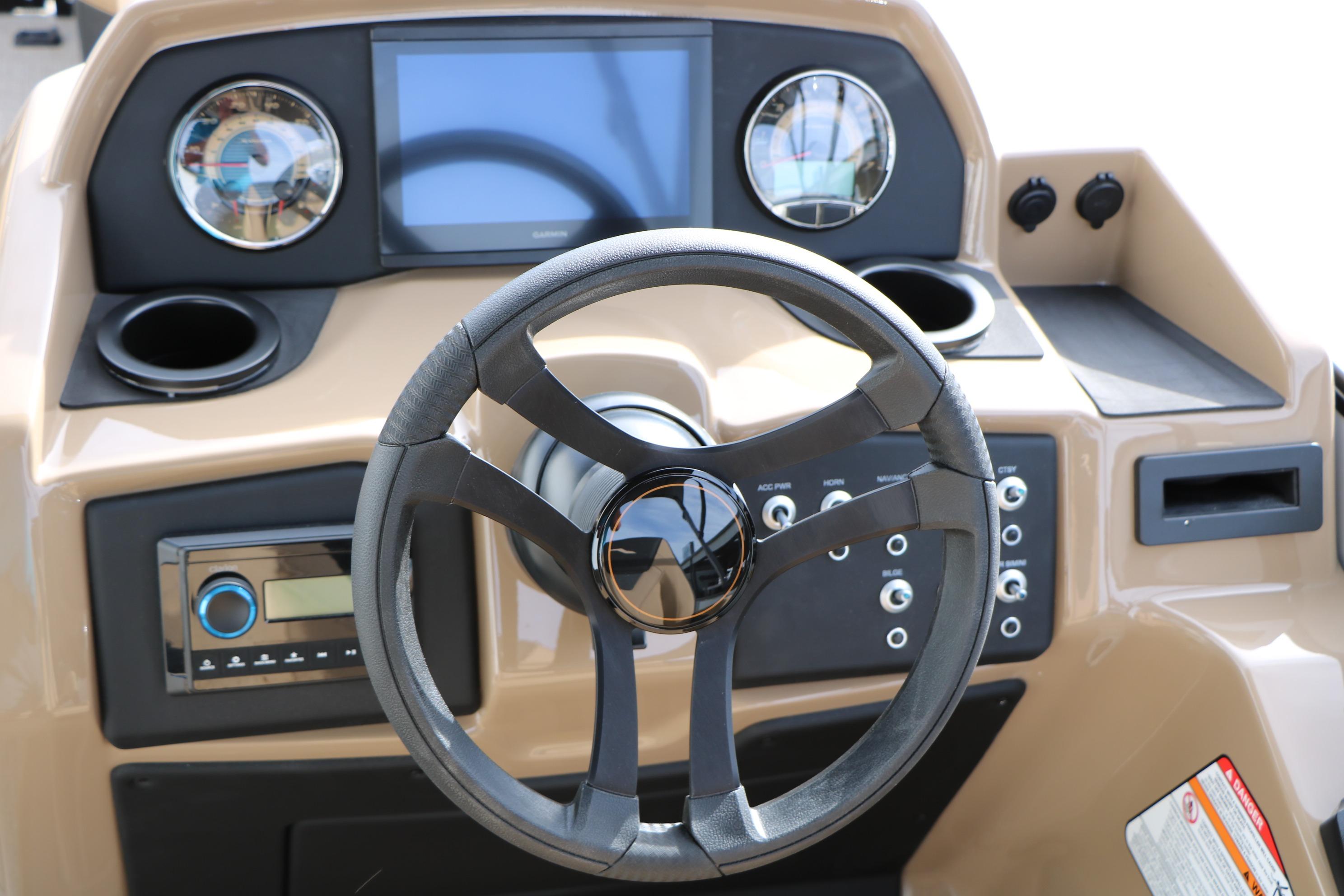 Steering console of 2026 Evotti 523CS boat with modern controls and display.