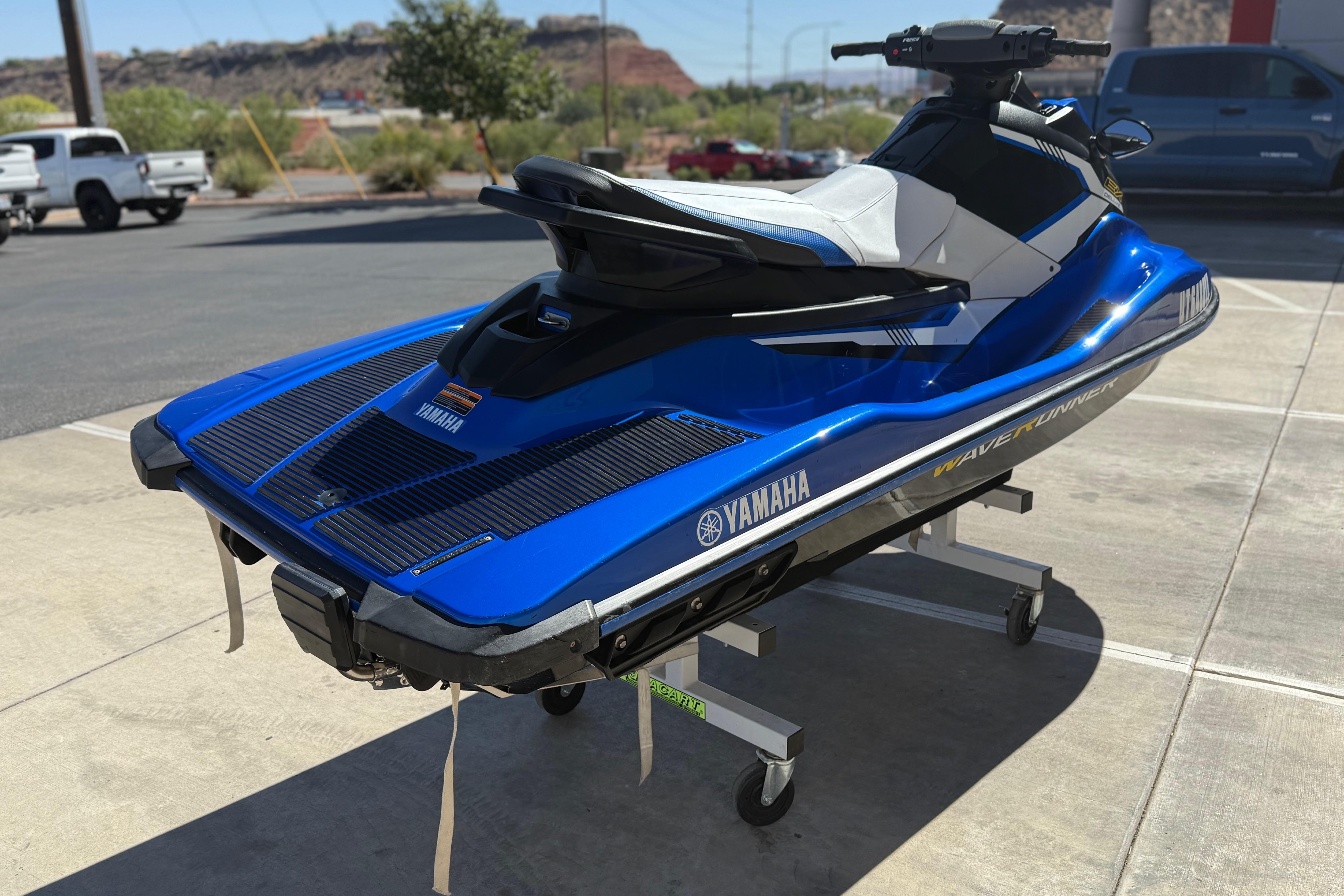 2017 Yamaha WaveRunner EX Deluxe in blue, parked on a stand outdoors.