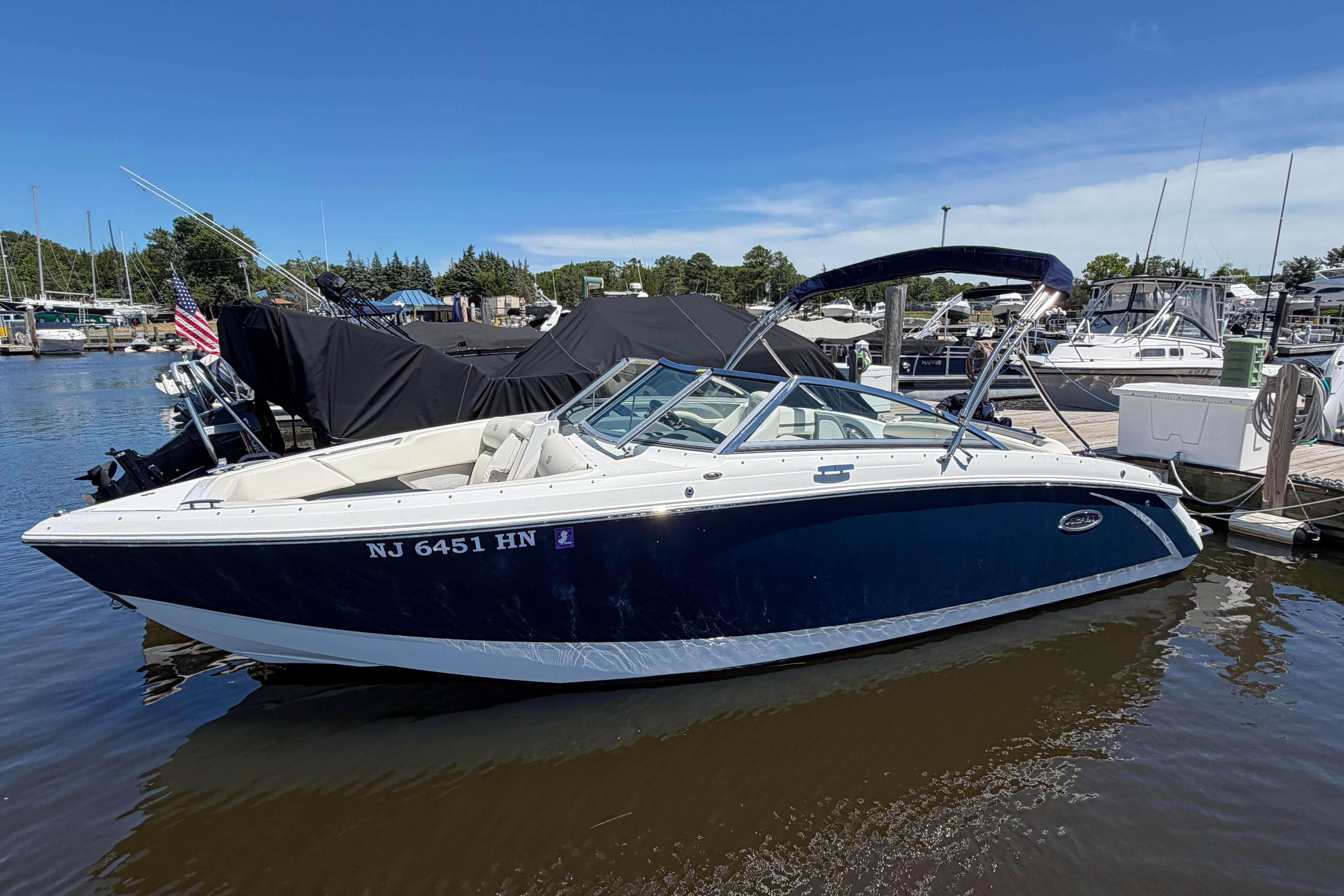 2020 Cobalt R3 boat docked at marina under clear blue sky.