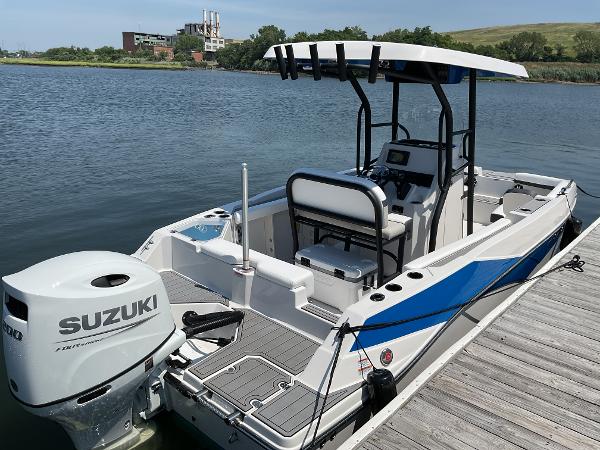 2025 Starcraft SVX 211 OB CC boat docked with Suzuki outboard motor.
